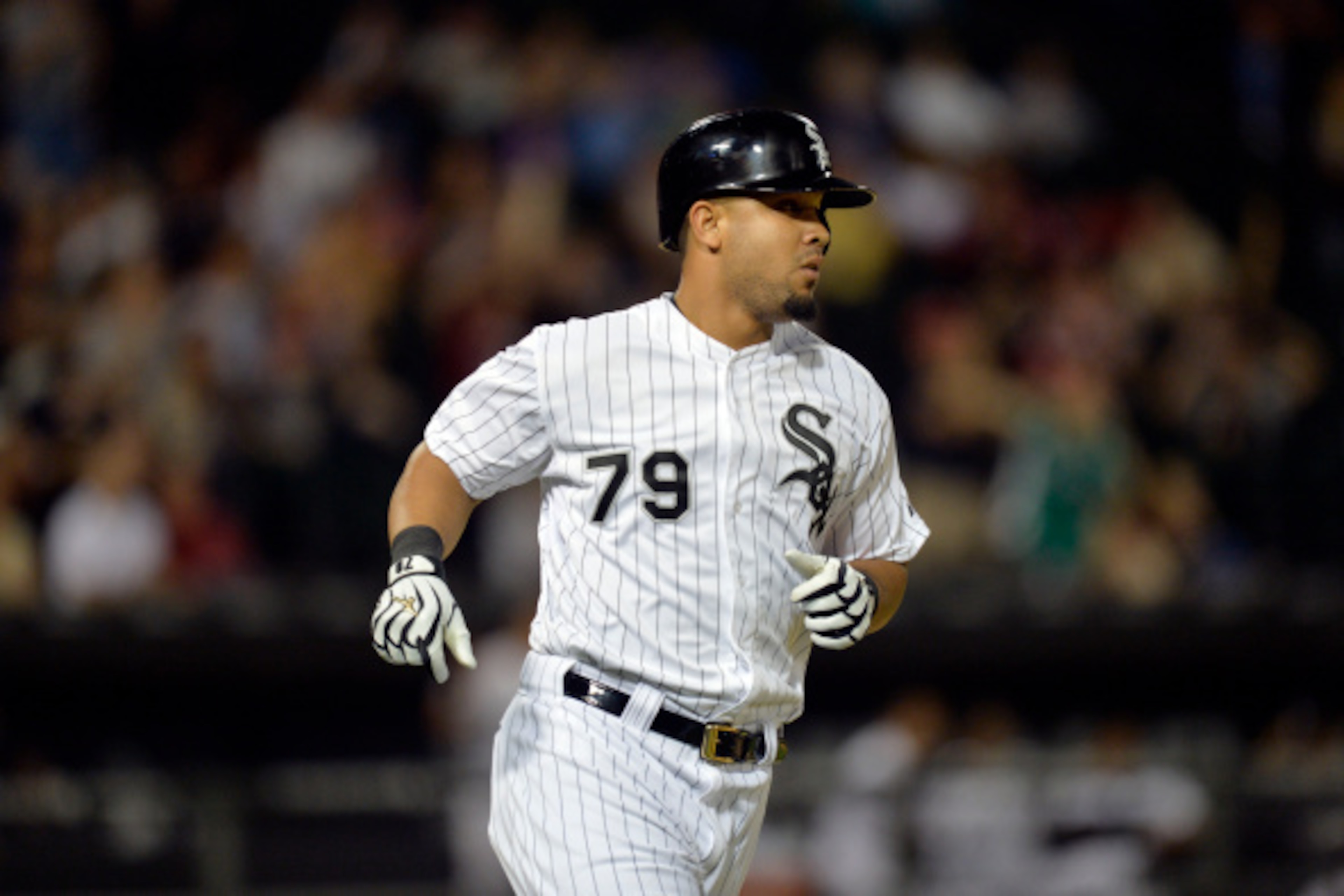CHICAGO, IL - AUGUST 27:  Jose Abreu #79 of the Chicago White Sox runs up the first base line after hitting an RBI single, scoring Adam Eaton during the seventh inning against the Cleveland Indians at U.S. Cellular Field on August 27, 2014 in Chicago, Ill