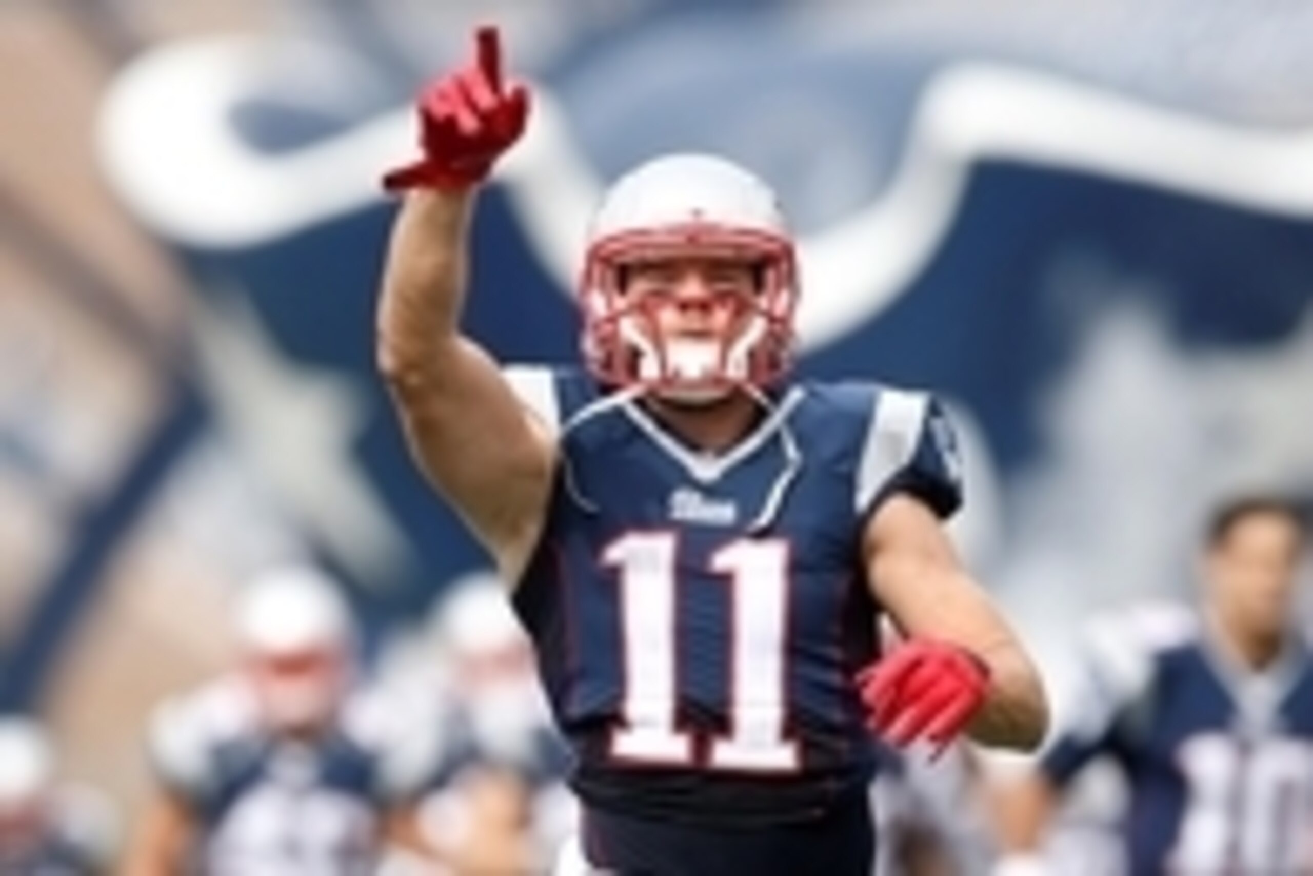 Sep 21, 2014; Foxborough, MA, USA; New England Patriots wide receiver Julian Edelman (11) runs onto the field before the game against the Oakland Raiders at Gillette Stadium. Mandatory Credit: Greg M. Cooper-USA TODAY Sports