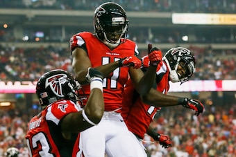 ATLANTA, GA - AUGUST 23: Julio Jones #11 celebrates a touchdown with Devin Hester #17 and Harry Douglas #83 of the Atlanta Falcons in the first half of a preseason game against the Tennessee Titans at the Georgia Dome on August 23, 2014 in Atlanta, Georgi