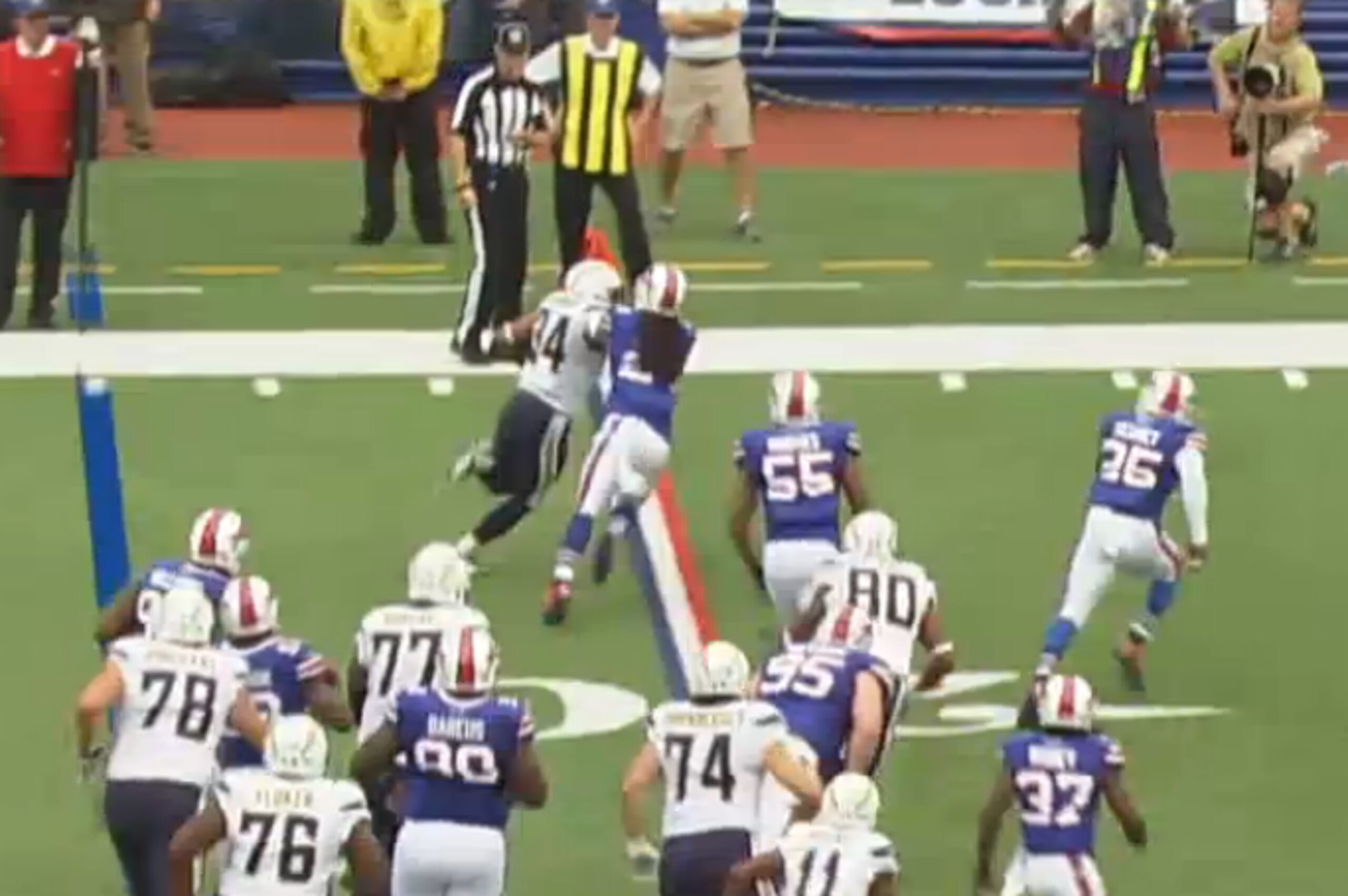 Brown fends off a defender in the open field.