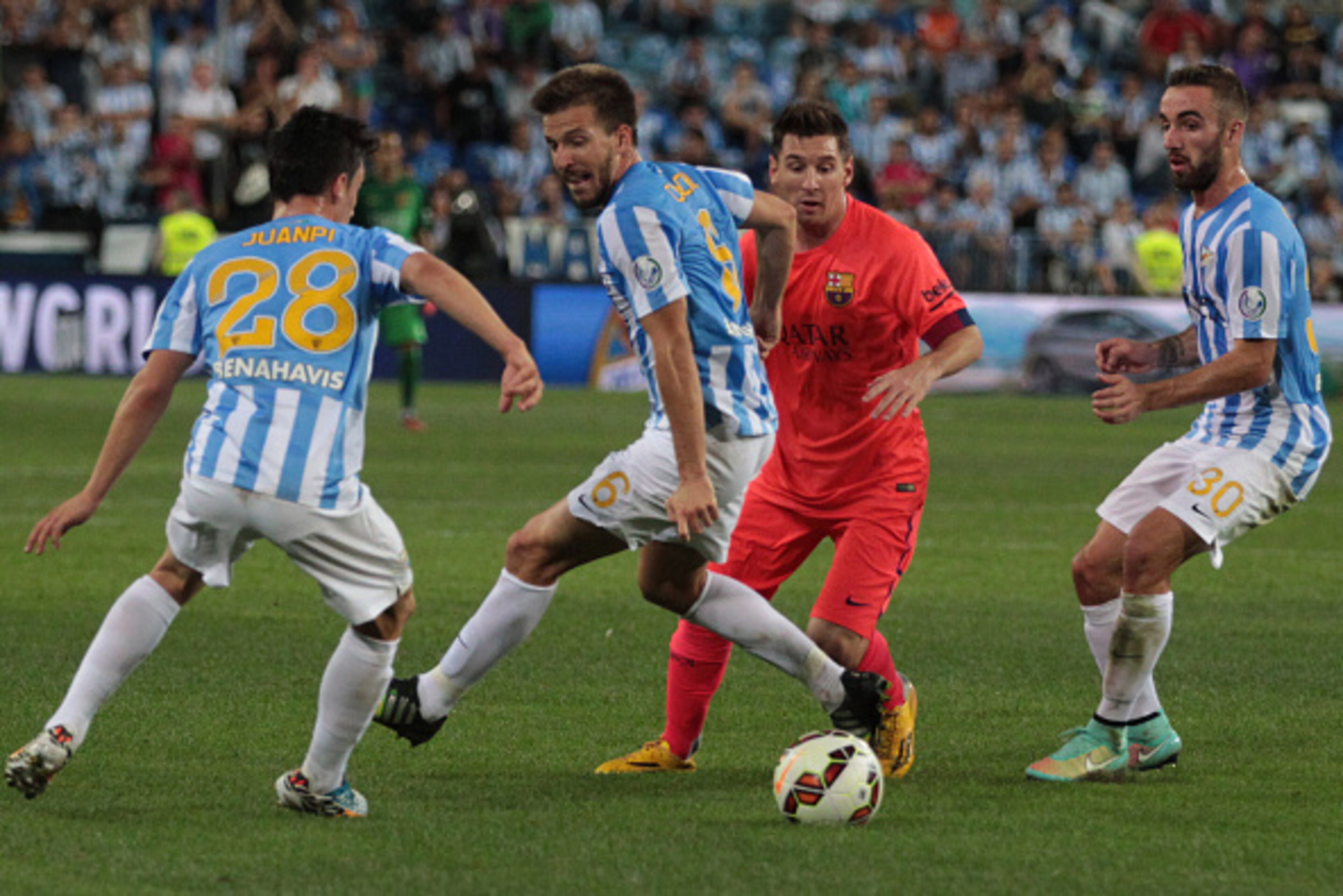 MALAGA, SPAIN - SEPTEMBER 24:  Lionel Messi of F.C. Barcelona, beats Ignacio Camacho of Malaga CF during the La Liga match between Malaga CF and FC Barcelona at La Rosaleda studium on September 24, 2014 in Malaga, Spain. (Photo by Sergio Camacho/Getty Ima