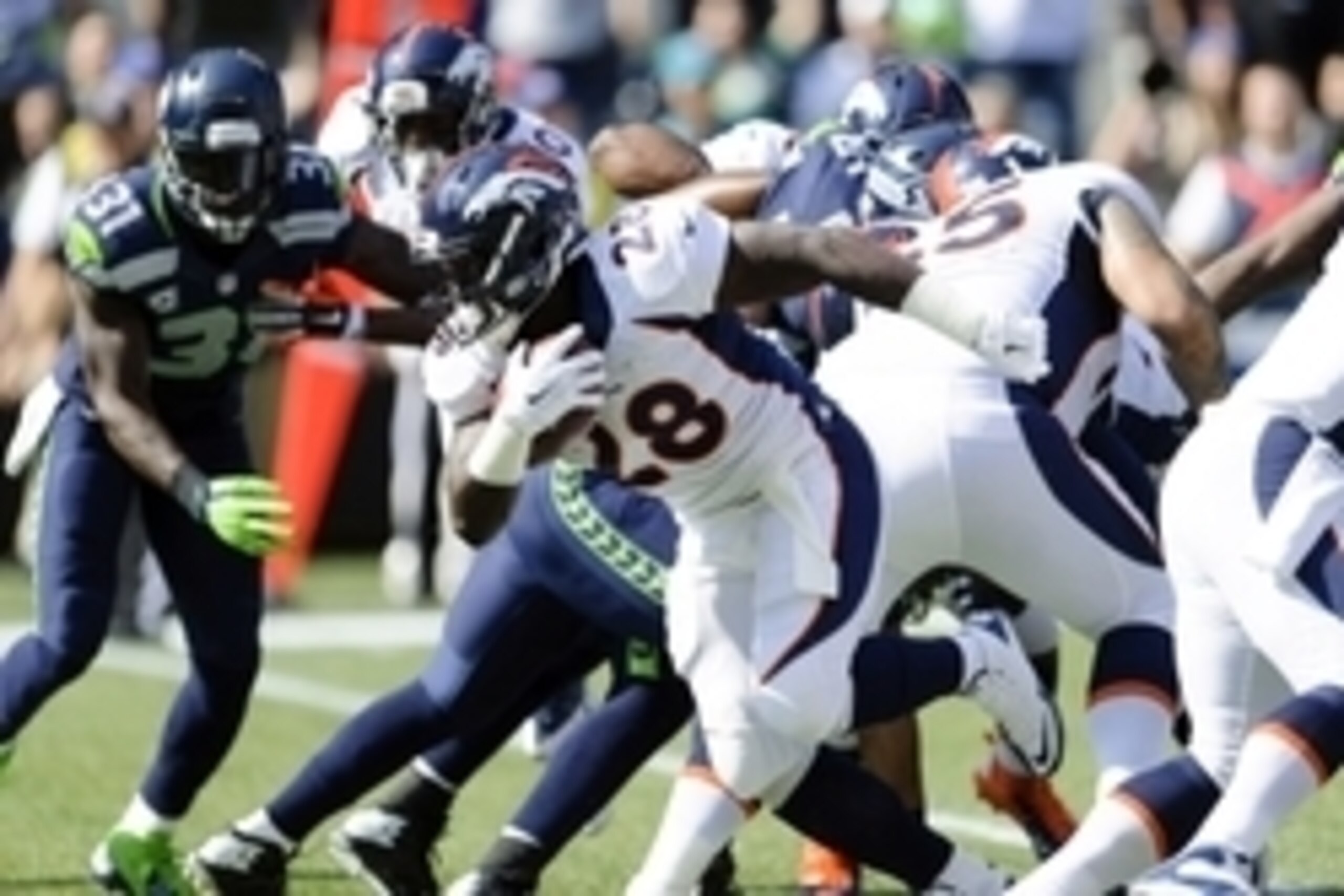 Sep 21, 2014; Seattle, WA, USA; Denver Broncos running back Montee Ball (28) carries the ball against the Seattle Seahawks during the first half at CenturyLink Field. Seattle defeated Denver 26-20. Mandatory Credit: Steven Bisig-USA TODAY Sports