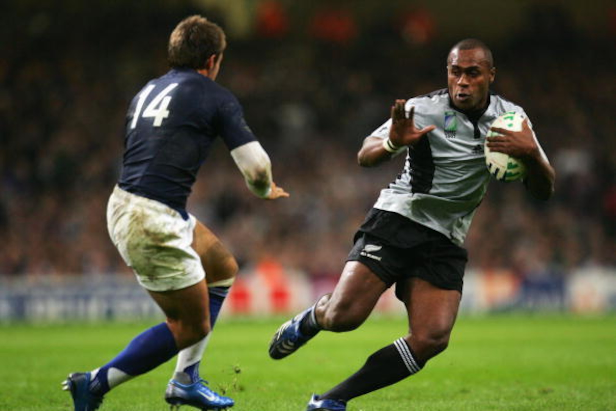 CARDIFF, UNITED KINGDOM - OCTOBER 06:  Sitiveni Sivivatu of New Zealand takes on Vincent Clerc of France during the Quarter Final of the Rugby World Cup 2007 match between New Zealand and France at the Millennium Stadium on October 6, 2007 in Cardiff, Uni