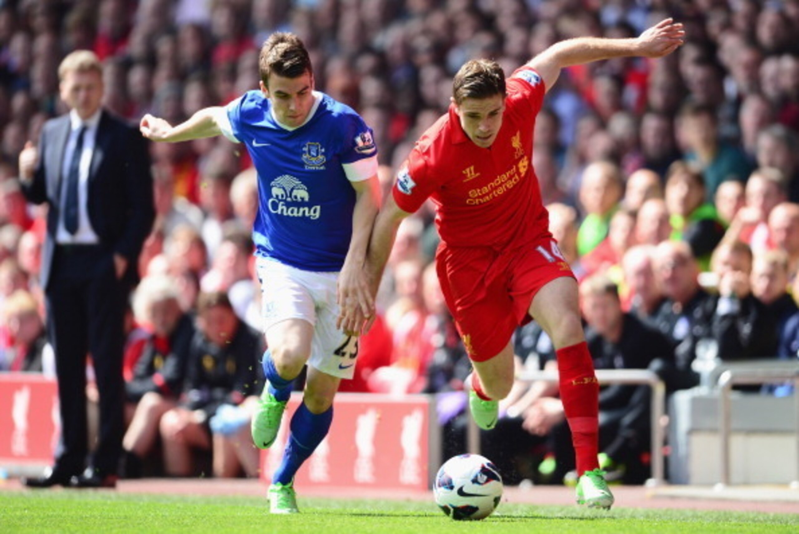 LIVERPOOL, ENGLAND - MAY 05:  Seamus Coleman of Everton battles for the ball with Jordan Henderson of Liverpool during the Barclays Premier League match between Liverpool and Everton at Anfield on May 5, 2013 in Liverpool, England.  (Photo by Laurence Gri