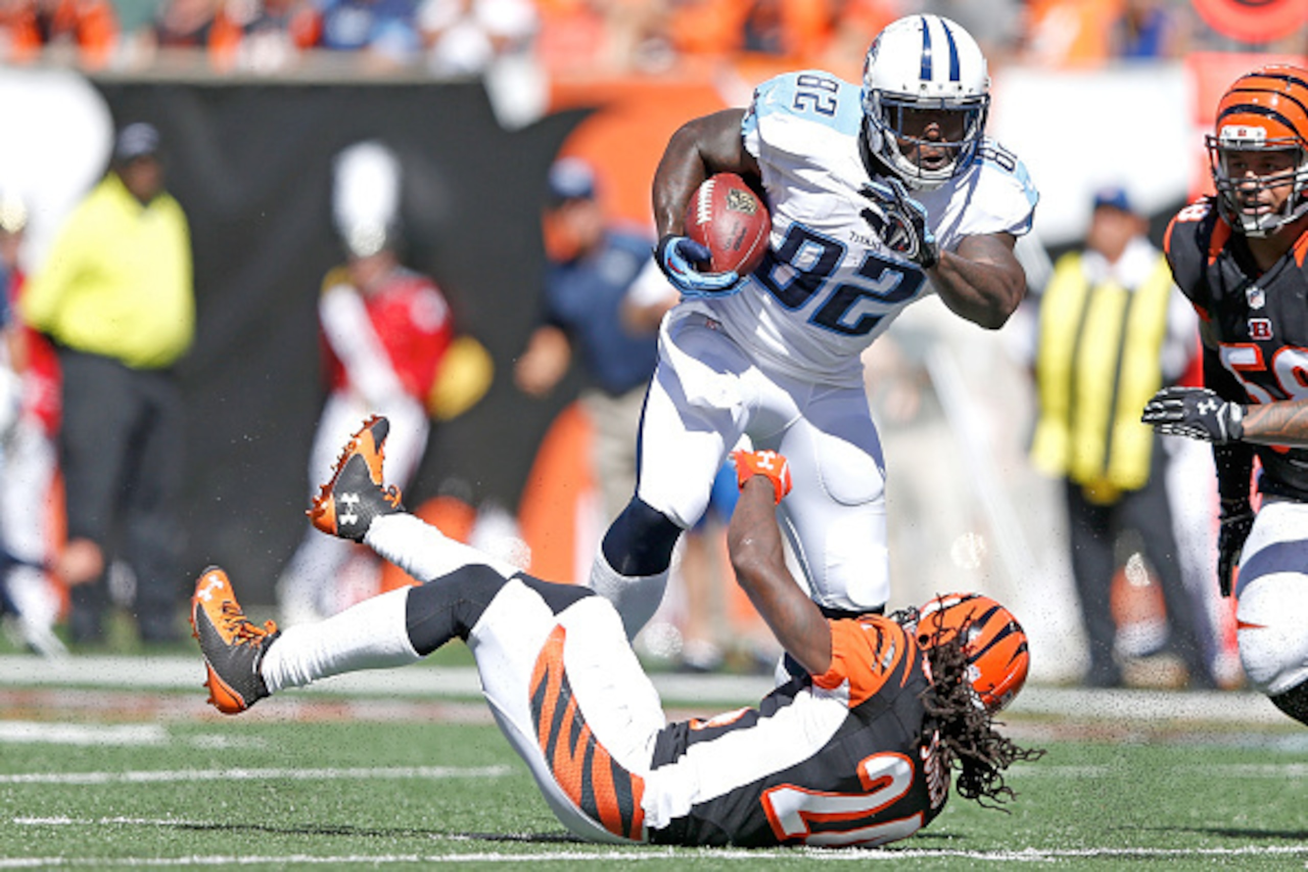 CINCINNATI, OH - SEPTEMBER 21:  Adam Jones #24 of the Cincinnati Bengals is unable to tackle Delanie Walker #82 of the Tennessee Titans during the second quarter at Paul Brown Stadium on September 21, 2014 in Cincinnati, Ohio. (Photo by Joe Robbins/Getty 