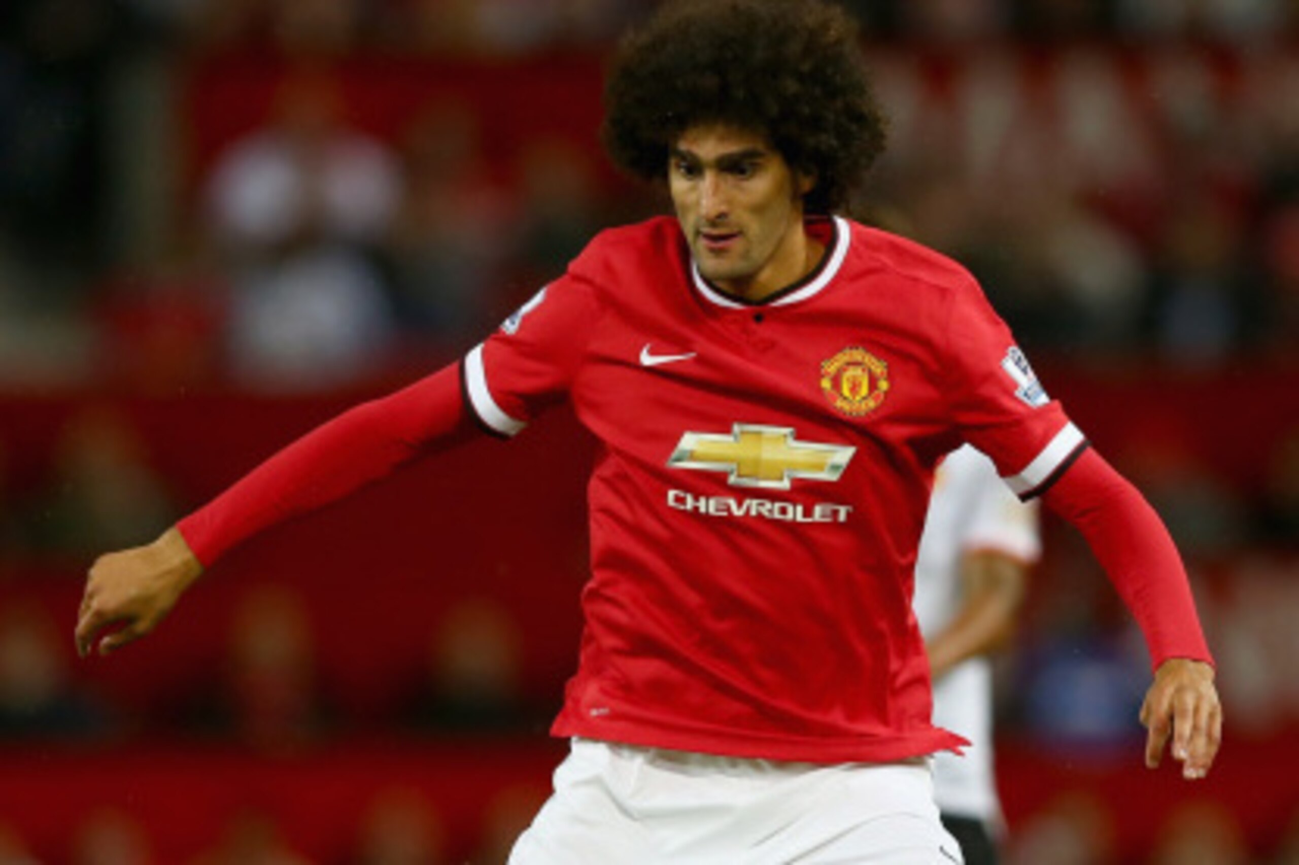 MANCHESTER, ENGLAND - AUGUST 12: Marouane Fellaini of Manchester United in action during the Pre Season Friendly match between Manchester United and Valencia at Old Trafford on August 12, 2014 in Manchester, England. (Photo by Clive Brunskill/Getty Imag MANCHESTER, ENGLAND - AUGUST 12: Marouane Fellaini of Manchester United in action during the Pre Season Friendly match between Manchester United and Valencia at Old Trafford on August 12, 2014 in Manchester, England. (Photo by Clive Brunskill/Getty Imag