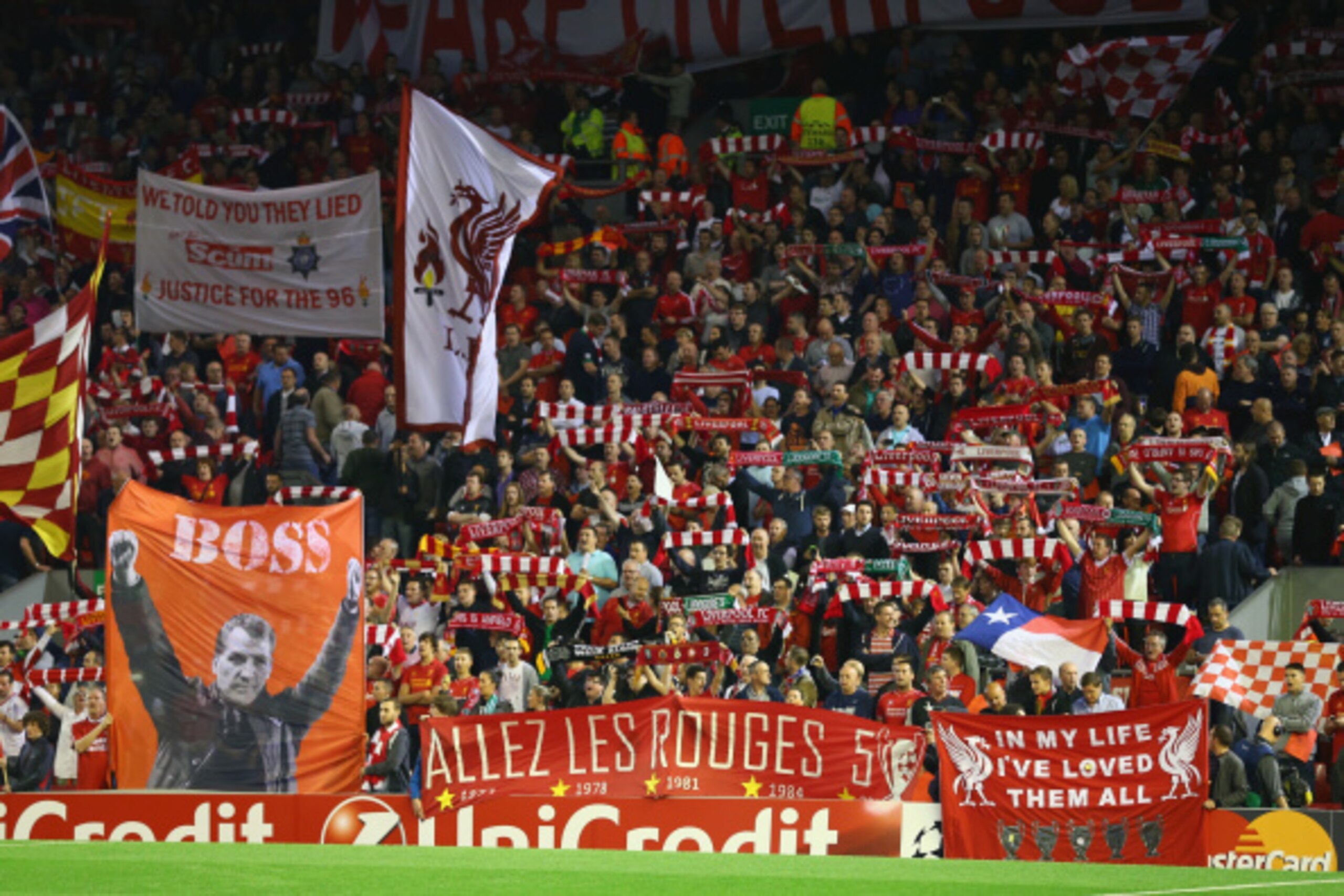 LIVERPOOL, ENGLAND - SEPTEMBER 16:  Liverpool fans show their colours during the UEFA Champions League Group B match between Liverpool FC and PFC Ludogorets Razgrad at Anfield on September 16, 2014 in Liverpool, United Kingdom.  (Photo by Clive Brunskill/