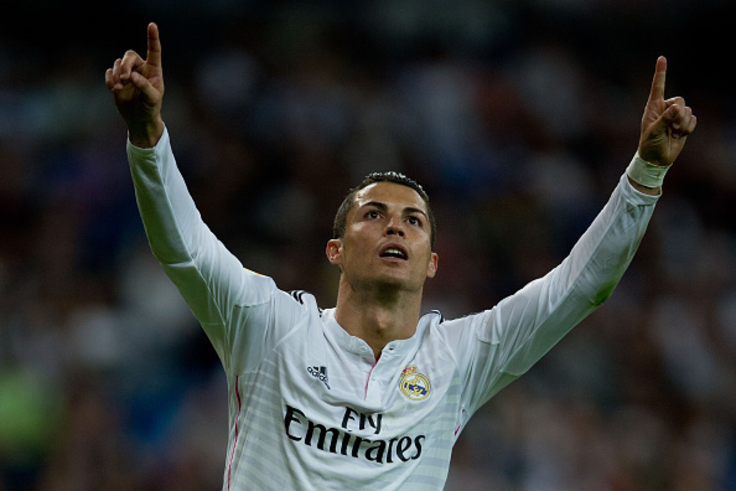 MADRID, SPAIN - SEPTEMBER 23:  Cristiano Ronaldo of Real Madrid CF celebrates scoring their fourth goal from a penalty shot during the La Liga match between Real Madrid CF and Elche CF at Estadio Santiago Bernabeu on September 23, 2014 in Madrid, Spain.  