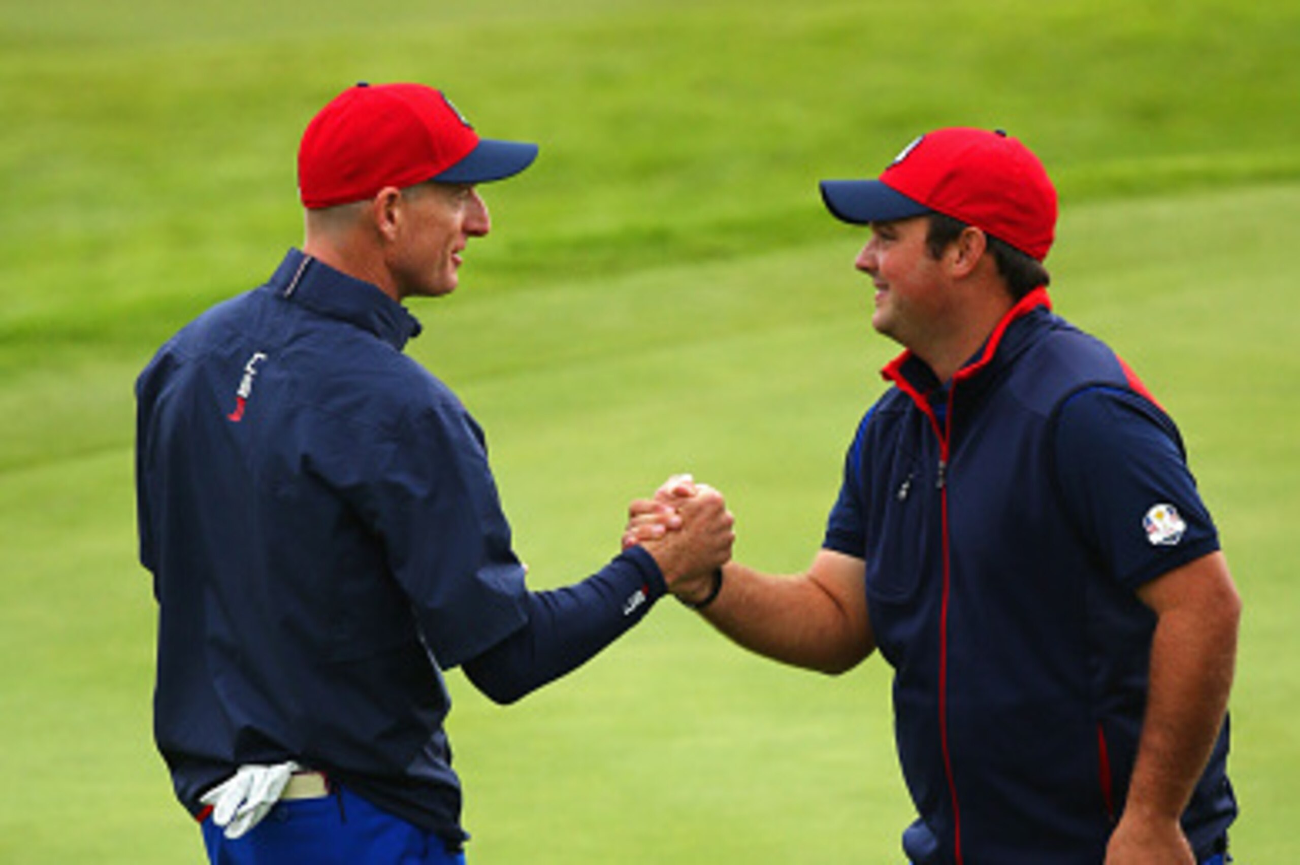 AUCHTERARDER, SCOTLAND - SEPTEMBER 25: Jim Furyk (L) of the United States shakes hands with Patrick Reed of the United States during practice ahead of the 2014 Ryder Cup on the PGA Centenary course at the Gleneagles Hotel on September 25, 2014 in Auchtera