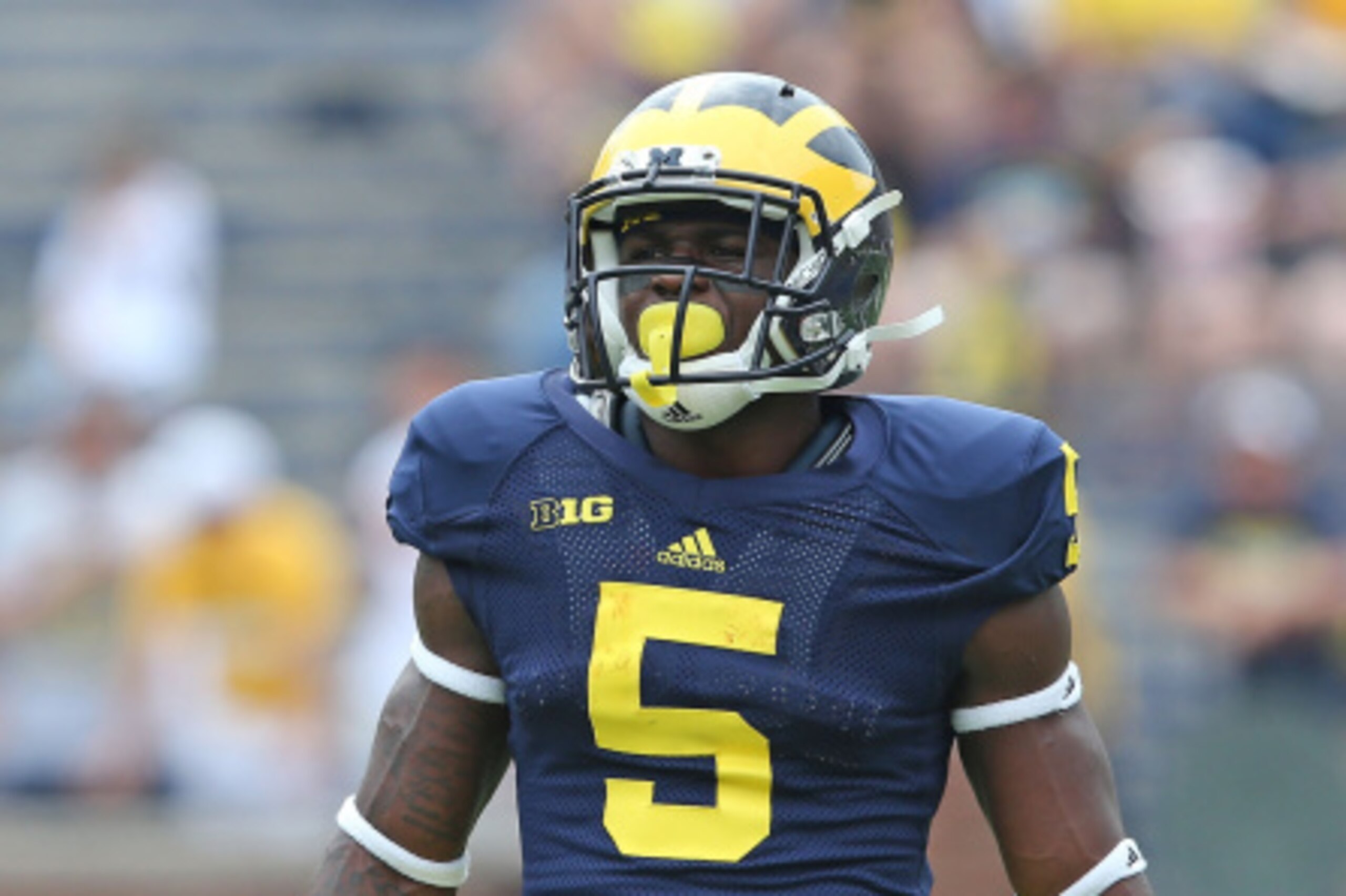 ANN ARBOR, MI - AUGUST 30:  Jabrill Peppers #5 of the Michigan Wolverines warms up prior to the start of the game against the Appalachian State Mountaineers on August 30, 2014 in Ann Arbor, Michigan. The Wolverines defeated the Mountaineers 52-14.  (Photo