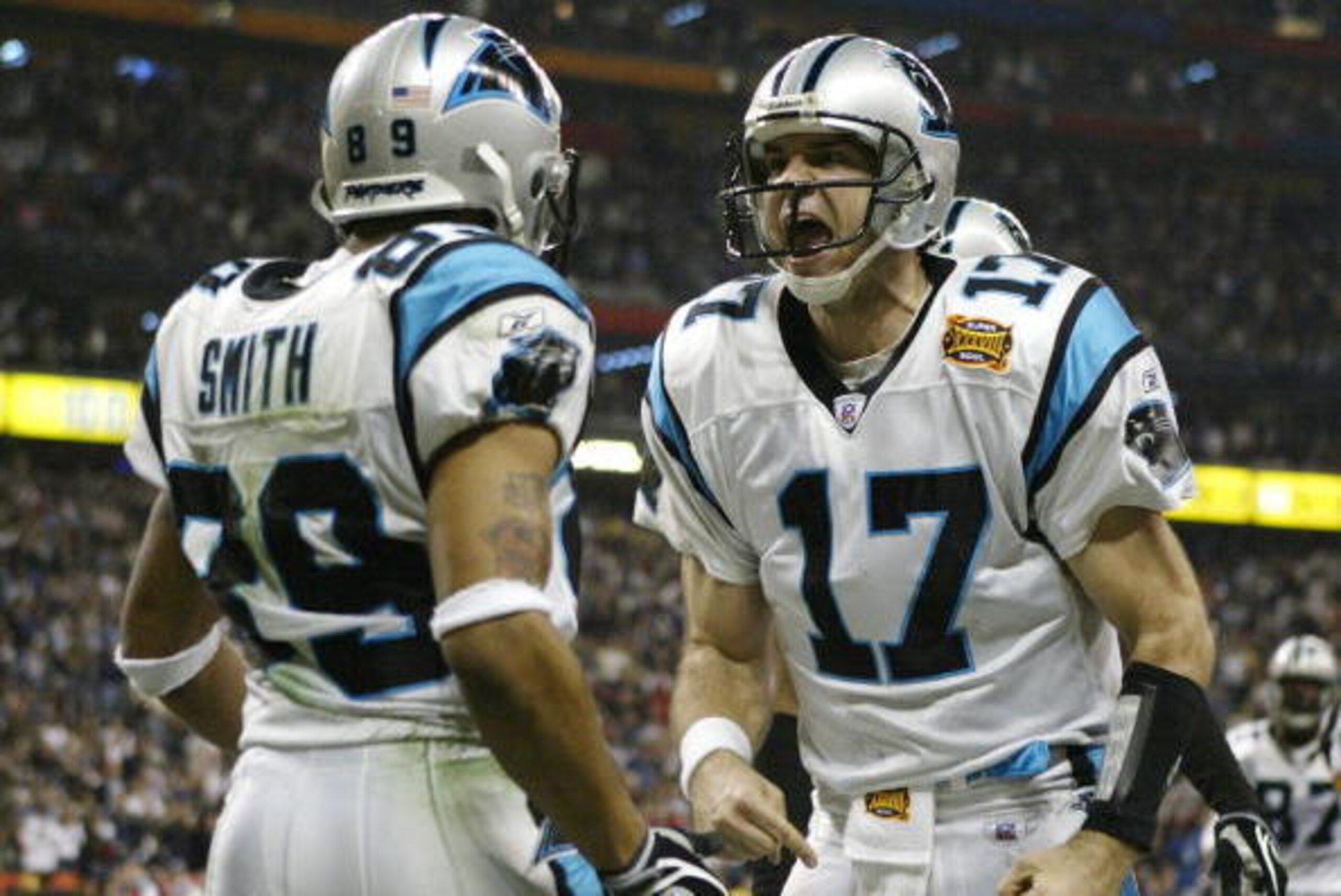 HOUSTON, TX - FEBRUARY 1:  Quarterback Jake Delhomme #17 of the Carolina Panthers celebrates with Steve Smith #89 after Smith caught a 5-yard touchdown pass in the second quarter during Super Bowl XXXVIII agains the New England Patriots at Reliant Stadium