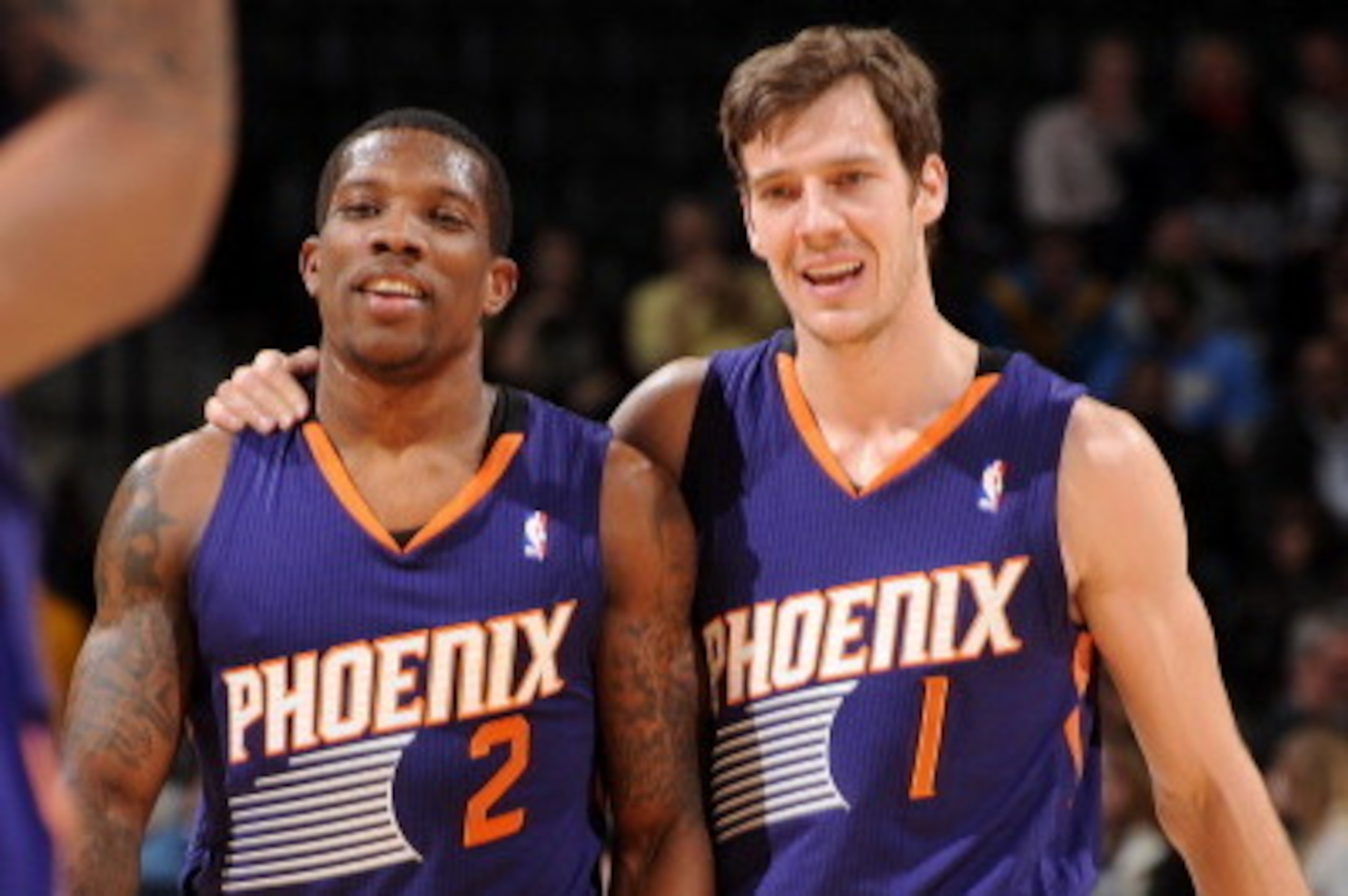 DENVER, CO - December 20:  Eric Bledsoe #2 and Goran Dragic #1 of the Phoenix Suns smile and walk off the court against the Denver Nuggets on December 20, 2013 at the Pepsi Center in Denver, Colorado. NOTE TO USER: User expressly acknowledges and agrees t