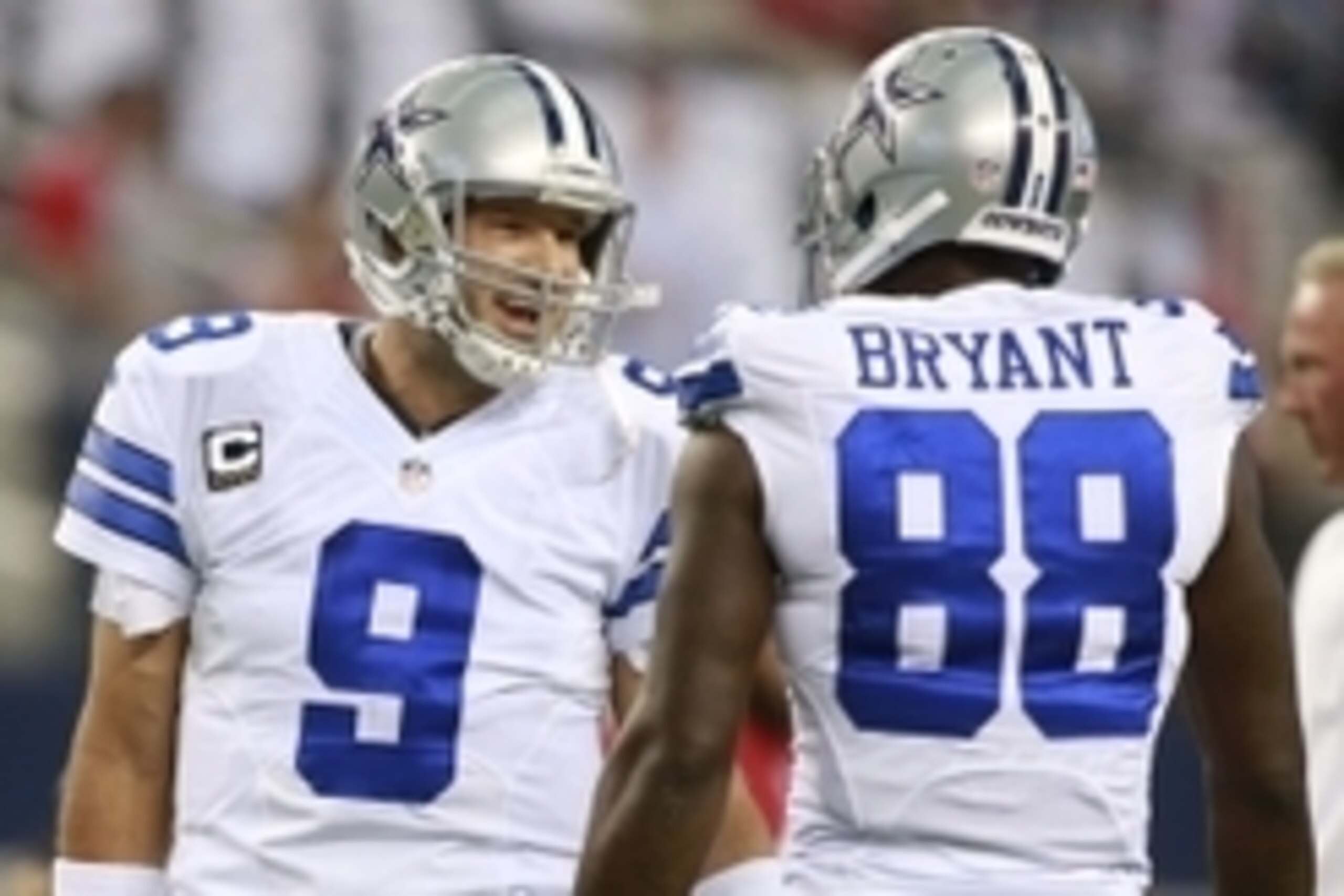 Sep 7, 2014; Arlington, TX, USA; Dallas Cowboys quarterback Tony Romo (9) talks with wide receiver Dez Bryant (88) before the game against the San Francisco 49ers at AT&T Stadium. Mandatory Credit: Tim Heitman-USA TODAY Sports
