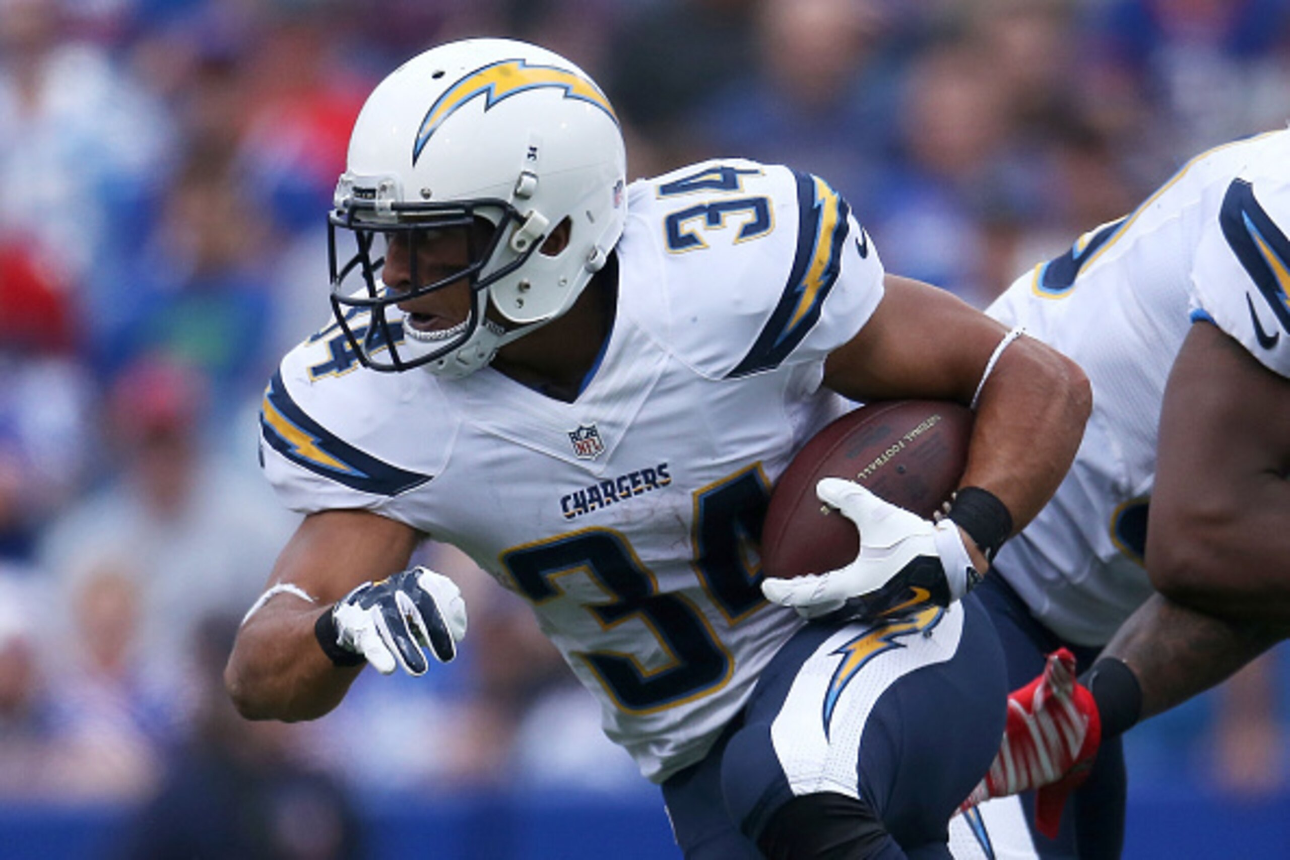 ORCHARD PARK, NY - SEPTEMBER 21:  Donald Brown #34 of the San Diego Chargers runs the ball against the Buffalo Bills during the first half at Ralph Wilson Stadium on September 21, 2014 in Orchard Park, New York.  (Photo by Tom Szczerbowski/Getty Images)