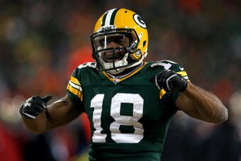 GREEN BAY, WI - JANUARY 05:  Randall Cobb #18 of the Green Bay Packers celebrates after a first down catch in the fourth quarter against the San Francisco 49ers during their NFC Wild Card Playoff game at Lambeau Field on January 5, 2014 in Green Bay, Wisc
