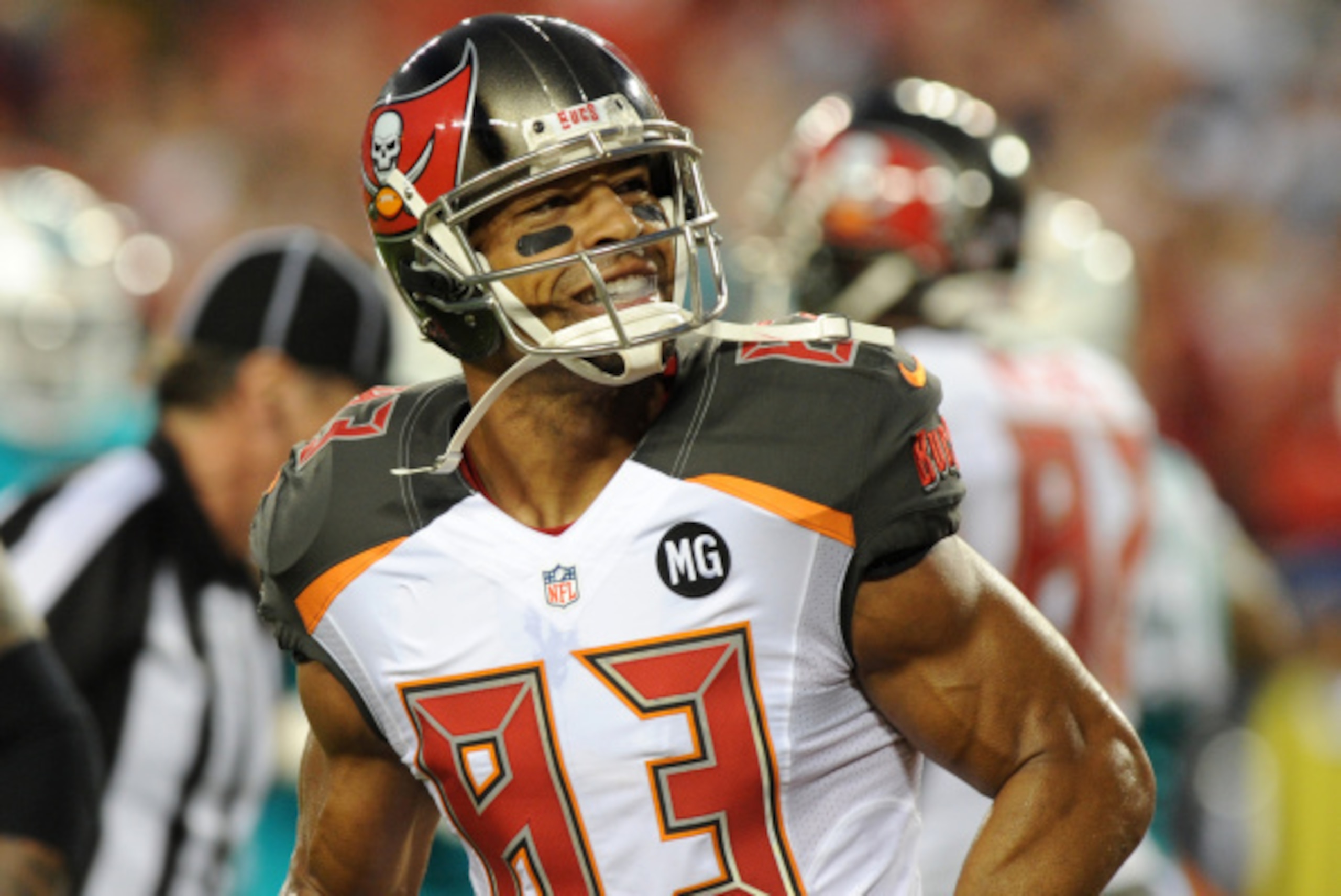 TAMPA, FL - AUGUST 16:  Wide receiver Vincent Jackson #83 of the Tampa Bay Buccaneers looks to the crowd after his TD catch against the Miami Dolphins in the first half at Raymond James Stadium on August 16, 2014 in Tampa, Florida. (Photo by Cliff McBride