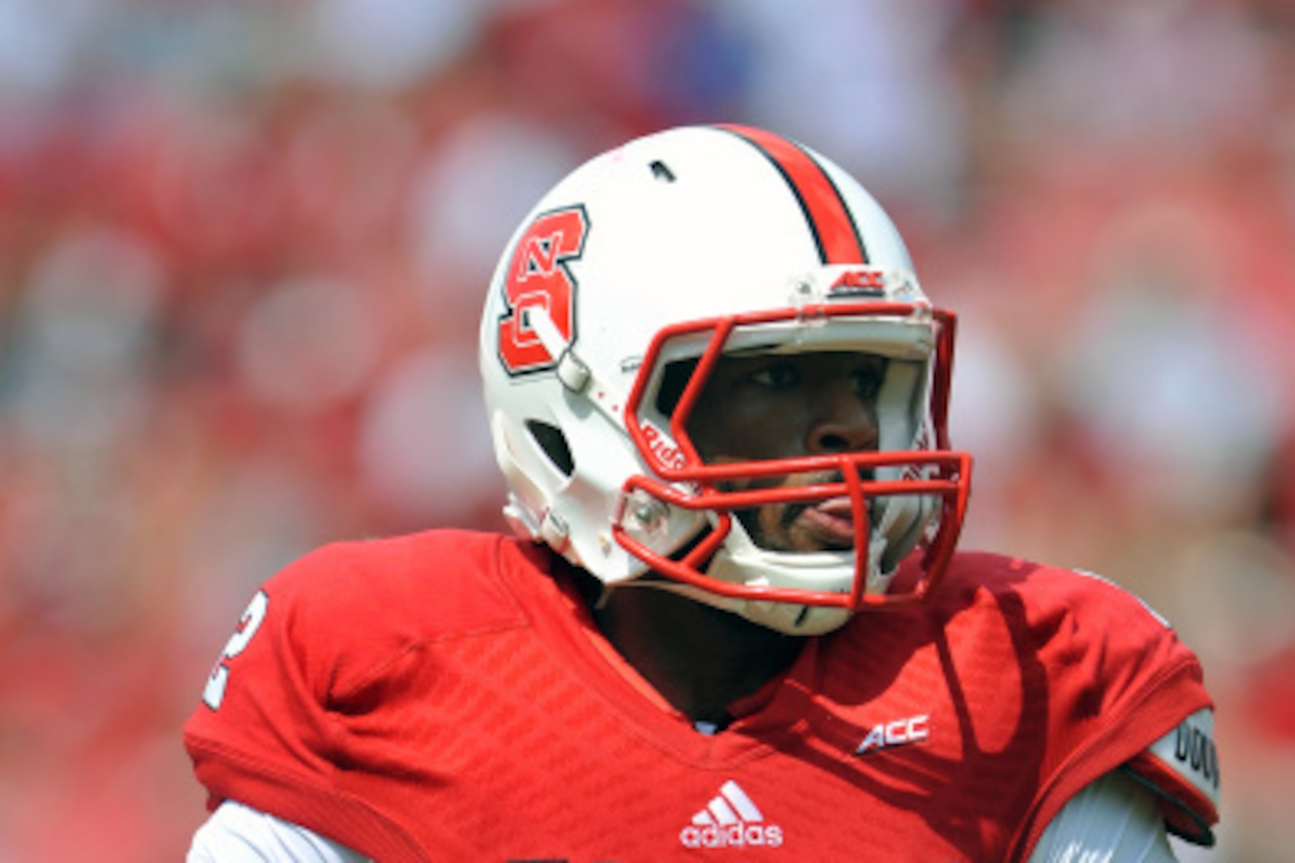 RALEIGH, NC - AUGUST 30: Jacoby Brissett #12 of the North Carolina State Wolfpack runs with the ball against the Georgia Southern Eagles at Carter-Finley Stadium on August 30, 2014 in Raleigh, North Carolina. NC State defeated Georgia Southern 24-23. (Pho