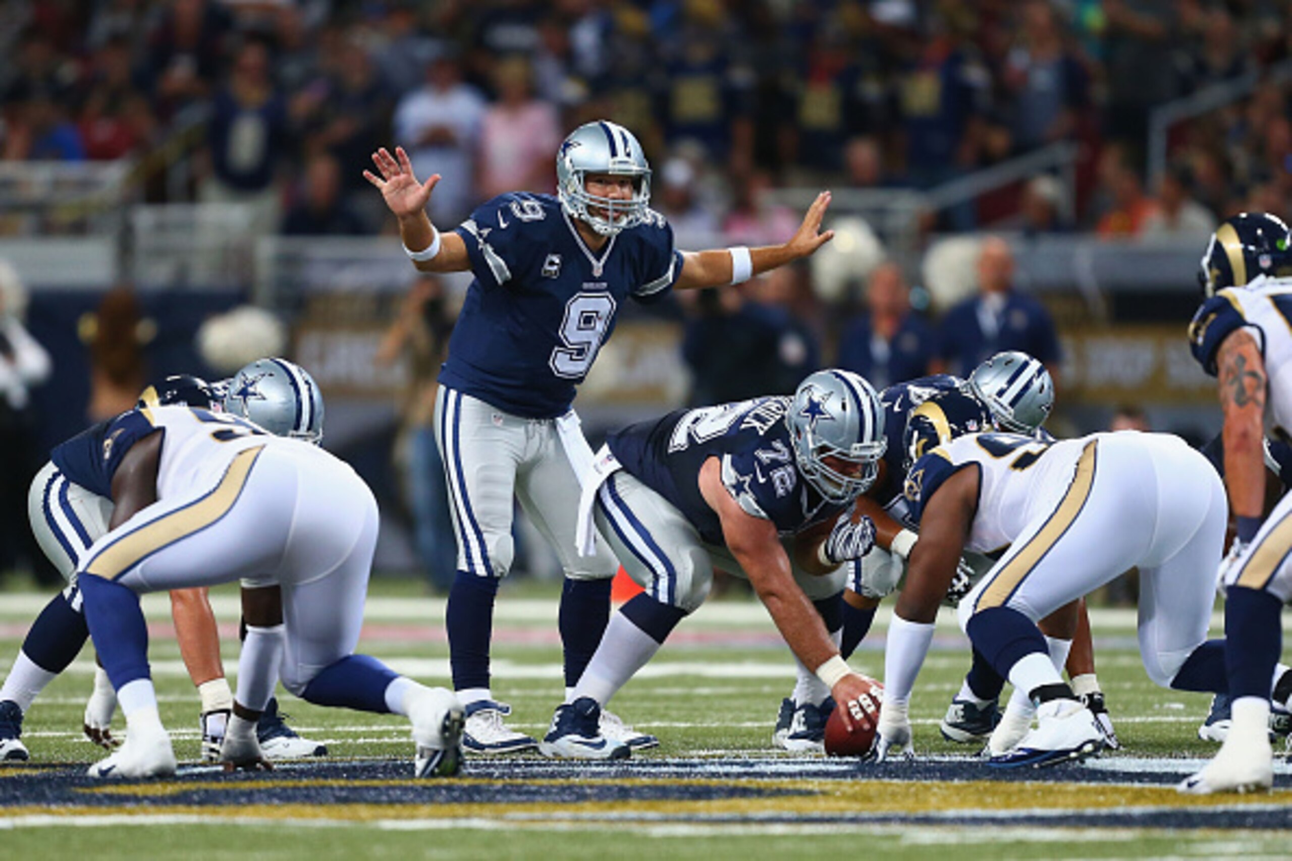ST. LOUIS, MO - SEPTEMBER 21: Tony Romo #9 of the Dallas Cowboys singles at the line of scrimmage during the third quarter against the St. Louis Rams at the Edward Jones Dome on September 21, 2014 in St. Louis, Missouri.  The Cowboys beat the Rams 34-31. 