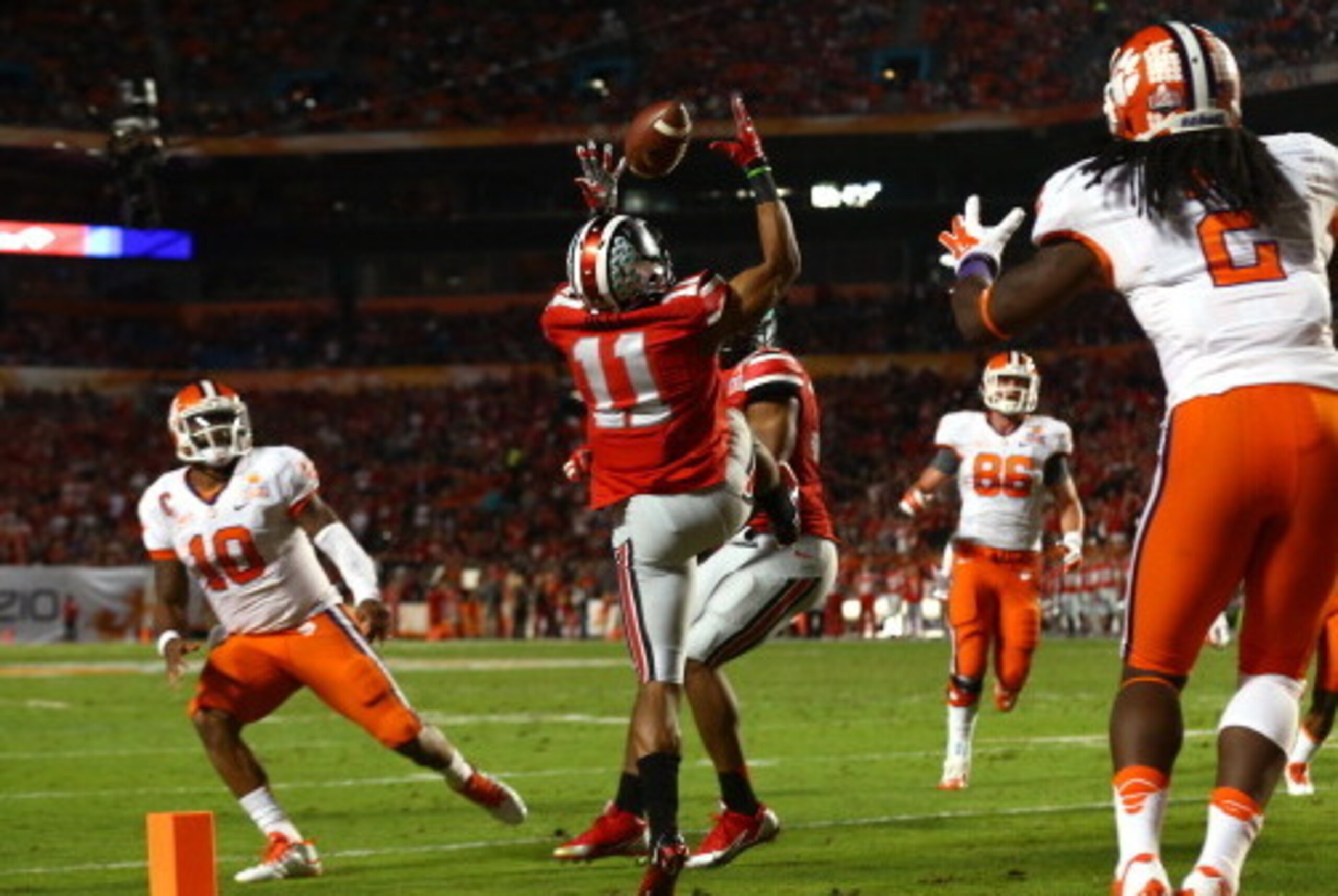 MIAMI GARDENS, FL - JANUARY 03:  Vonn Bell #11 of the Ohio State Buckeyes intercepts a pass thrown by Tajh Boyd #10 of the Clemson Tigers in the second quarter during the Discover Orange Bowl at Sun Life Stadium on January 3, 2014 in Miami Gardens, Florid