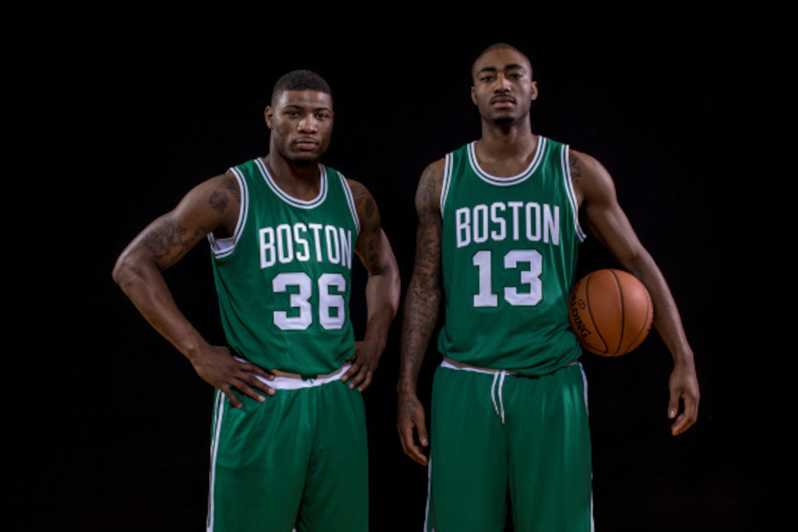 TARRYTOWN, NY - AUGUST 03:  Marcus Smart #36 and James Young #13 of the Boston Celtics pose for a portrait during the 2014 NBA rookie photo shoot at MSG Training Center on August 3, 2014 in Tarrytown, New York. NOTE TO USER: User expressly acknowledges an