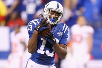 INDIANAPOLIS, IN - JANUARY 04:  T.Y. Hilton #13 of the Indianapolis Colts catches the game winning touchdown pass during the NFL Wild Card Playoff game against the Kansas City Chiefs at Lucas Oil Stadium on January 4, 2014 in Indianapolis, Indiana.  (Phot