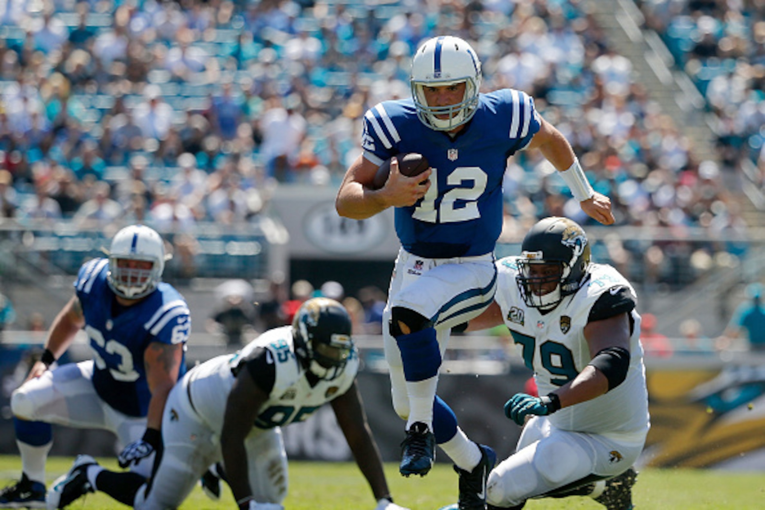 JACKSONVILLE, FL - SEPTEMBER 21: Andrew Luck #12 of the Indianapolis Colts carries during the second quarter of the game at EverBank Field on September 21, 2014 in Jacksonville, Florida.  (Photo by Rob Foldy/Getty Images)