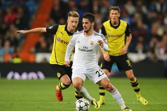 MADRID, SPAIN - APRIL 02:  Isco of Real Madrid is closed down by Marco Reus (L) of Borussia Dortmund during the UEFA Champions League Quarter Final first leg match between Real Madrid and Borussia Dortmund at Estadio Santiago Bernabeu on April 2, 2014 in 