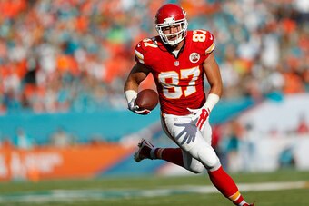 MIAMI GARDENS, FL - SEPTEMBER 21:  Tight end Travis Kelce #87 of the Kansas City Chiefs returns a turnover for a second-quarter touchdown against the Miami Dolphins during their game at Sun Life Stadium on September 21, 2014 in Miami Gardens, Florida.  (P