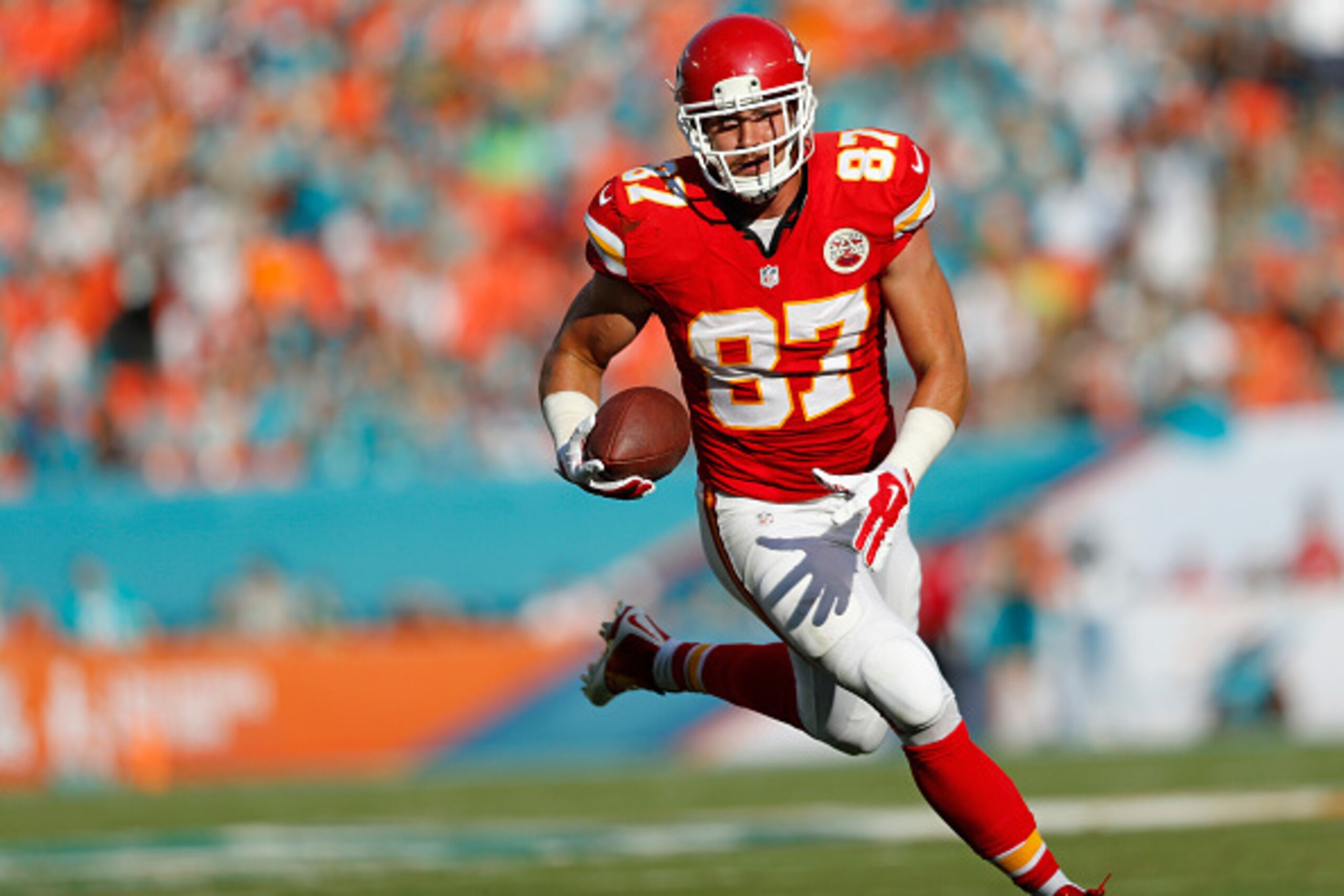 MIAMI GARDENS, FL - SEPTEMBER 21:  Tight end Travis Kelce #87 of the Kansas City Chiefs returns a turnover for a second-quarter touchdown against the Miami Dolphins during their game at Sun Life Stadium on September 21, 2014 in Miami Gardens, Florida.  (P