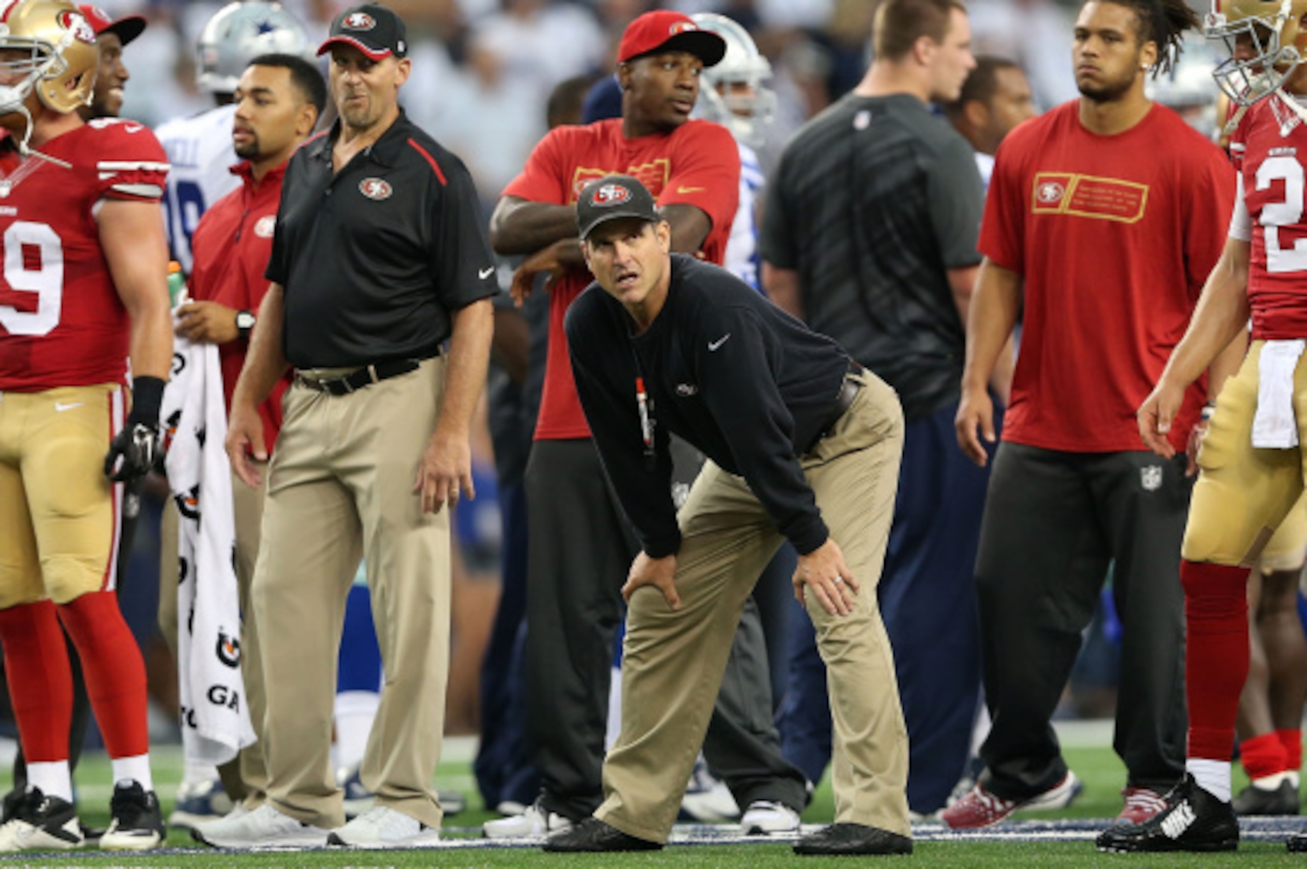 ARLINGTON, TX - SEPTEMBER 07:  Head coach Jim Harbaugh of the San Francisco 49ers watches during warmups before the game against the Dallas Cowboys at AT&T Stadium on September 7, 2014 in Arlington, Texas.  (Photo by Christian Petersen/Getty Images)