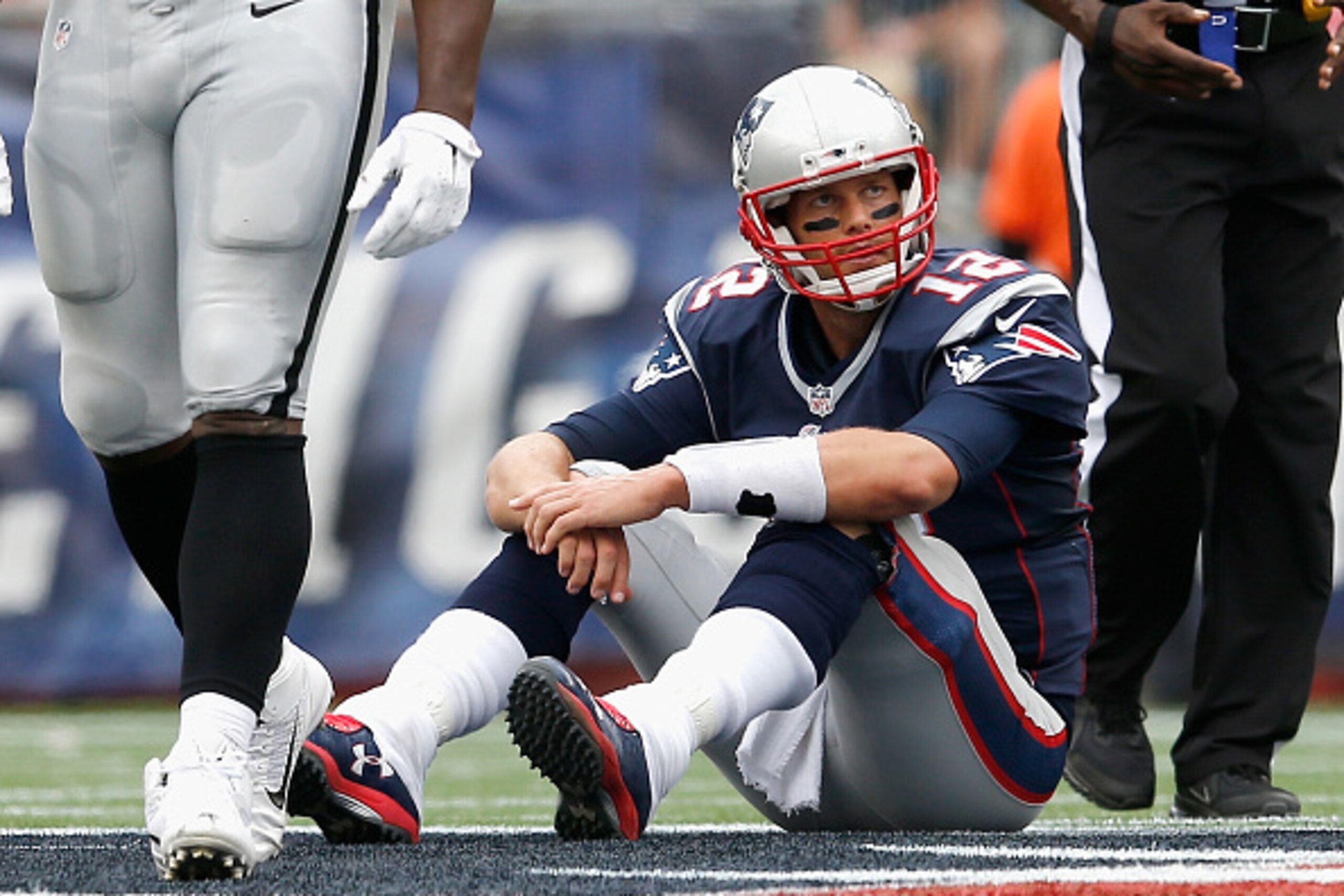 FOXBORO, MA - SEPTEMBER 21:  Tom Brady #12 of the New England Patriots reacts during the second quarter against the Oakland Raiders at Gillette Stadium on September 21, 2014 in Foxboro, Massachusetts.  (Photo by Jim Rogash/Getty Images)
