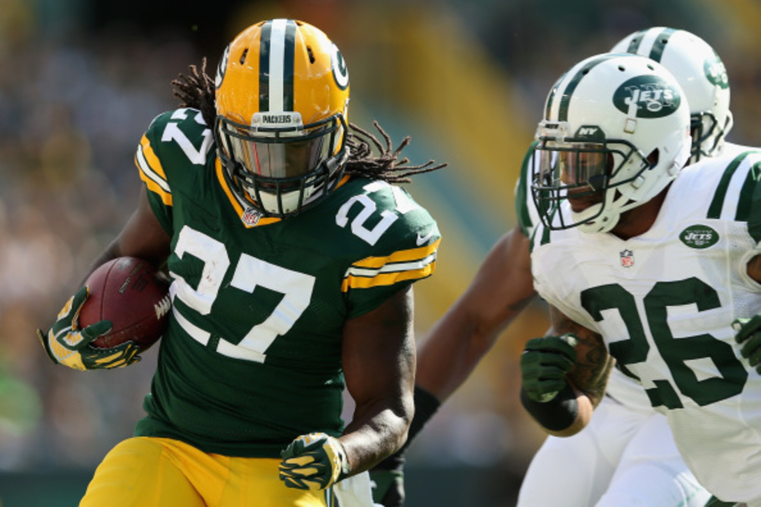 GREEN BAY, WI - SEPTEMBER 14:  Running back Eddie Lacy #27 of the Green Bay Packers rushes the football against the New York Jets during the NFL game at Lambeau Field on September 14, 2014 in Green Bay, Wisconsin.  The Packers defeated the Jets 31-24.  (P