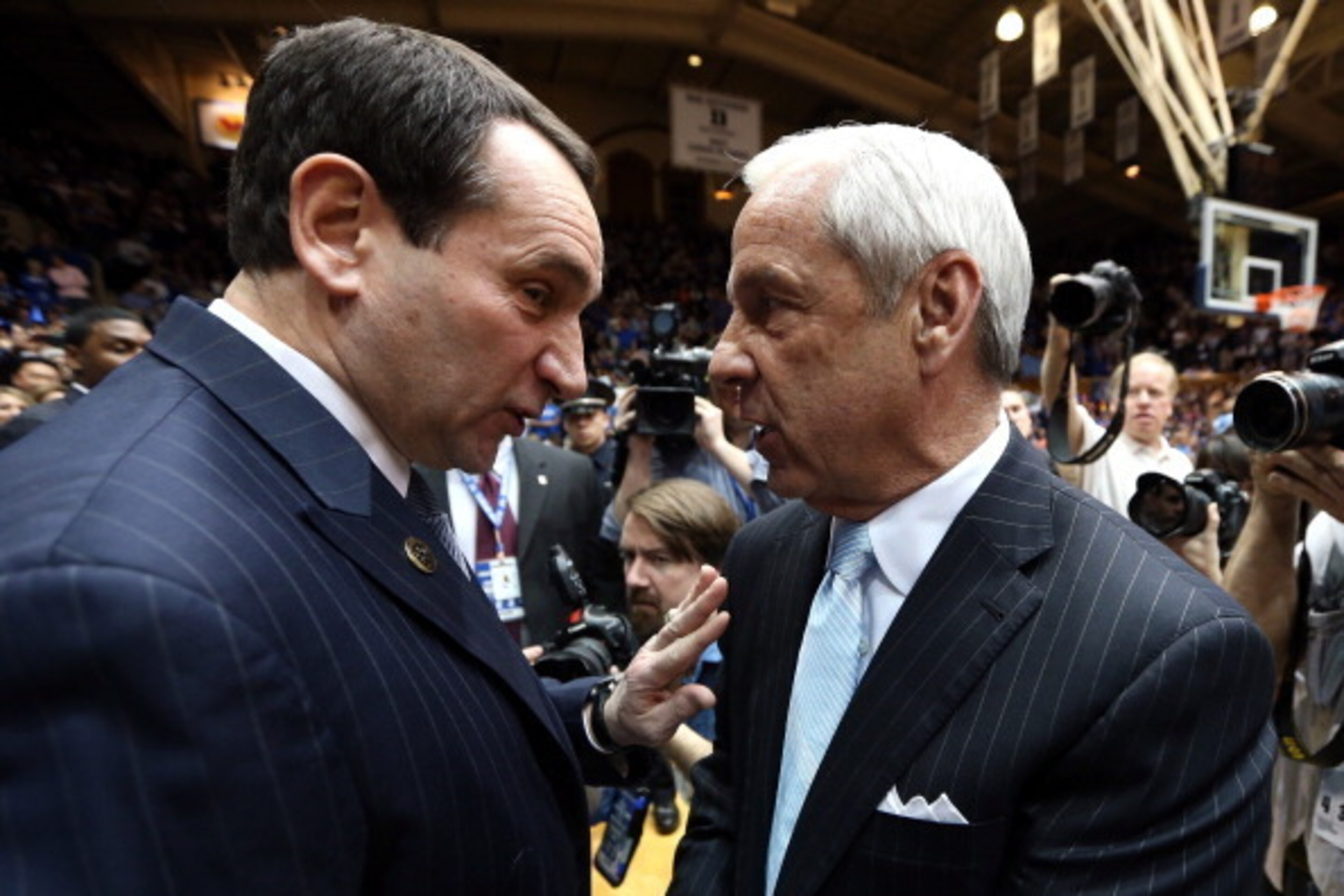 DURHAM, NC - FEBRUARY 13:  (L-R) Head coach Mike Krzyzewski of the Duke Blue Devils shakes hands with head coach Roy Williams of the North Carolina Tar Heels before their game at Cameron Indoor Stadium on February 13, 2013 in Durham, North Carolina.  (Pho