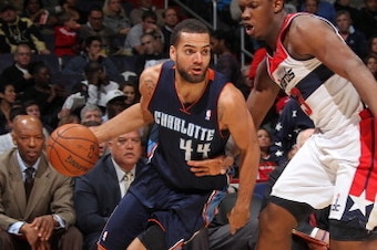 WASHINGTON, DC - NOVEMBER 24: Jeff Taylor #44 of the Charlotte Bobcats drives against Kevin Seraphin #13 of the Washington Wizards during the game at the Verizon Center on November 24, 2012 in Washington, DC. NOTE TO USER: User expressly acknowledges and 