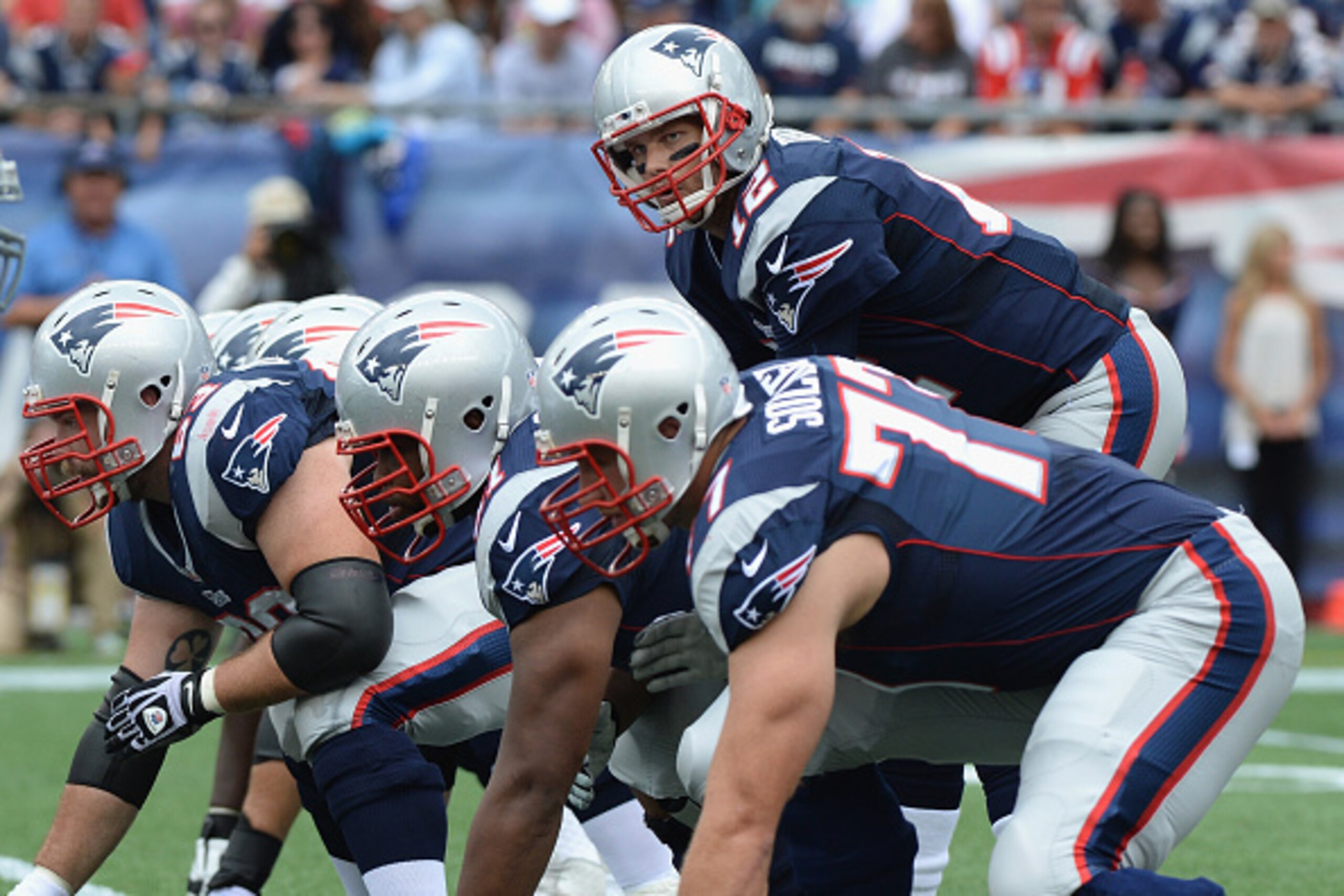 FOXBORO, MA - SEPTEMBER 21: Tom Brady #12 of the New England Patriots at the line of scrimmage during the second quarter against the Oakland Raiders at Gillette Stadium on September 21, 2014 in Foxboro, Massachusetts. (Photo by Darren McCollester/Getty Im