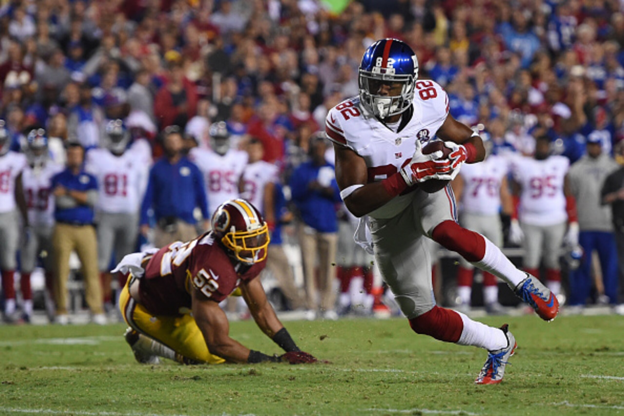 LANDOVER, MD - SEPTEMBER 25: Wide receiver Rueben Randle #82 of the New York Giants is pressured by inside linebacker Keenan Robinson #52 of the Washington Redskins during 2nd quarter of their game at FedExField on September 25, 2014 in Landover, Maryland