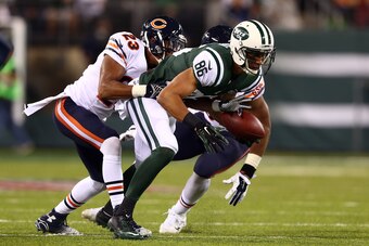EAST RUTHERFORD, NJ - SEPTEMBER 22:  Wide receiver David Nelson #86 of the New York Jets tries to gain control of the ball as cornerback Kyle Fuller #23 of the Chicago Bears defends during a game at MetLife Stadium on September 22, 2014 in East Rutherford