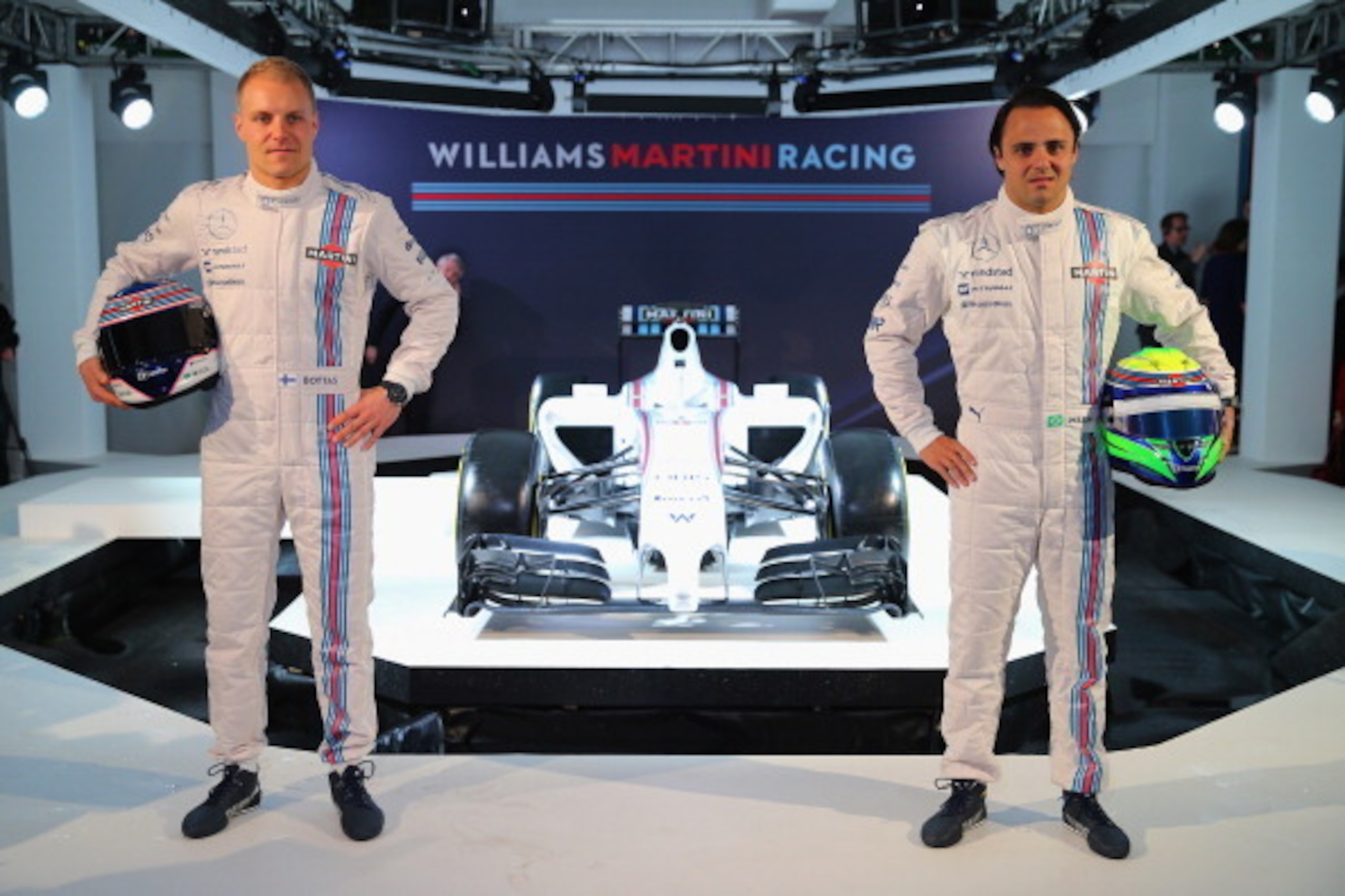 LONDON, ENGLAND - MARCH 06:  Valtteri Bottas of Finland and Felipe Massa of Brazil pose with the Williams Martini Racing formula one car on March 6, 2014 in London, England.  (Photo by Clive Rose/Getty Images)