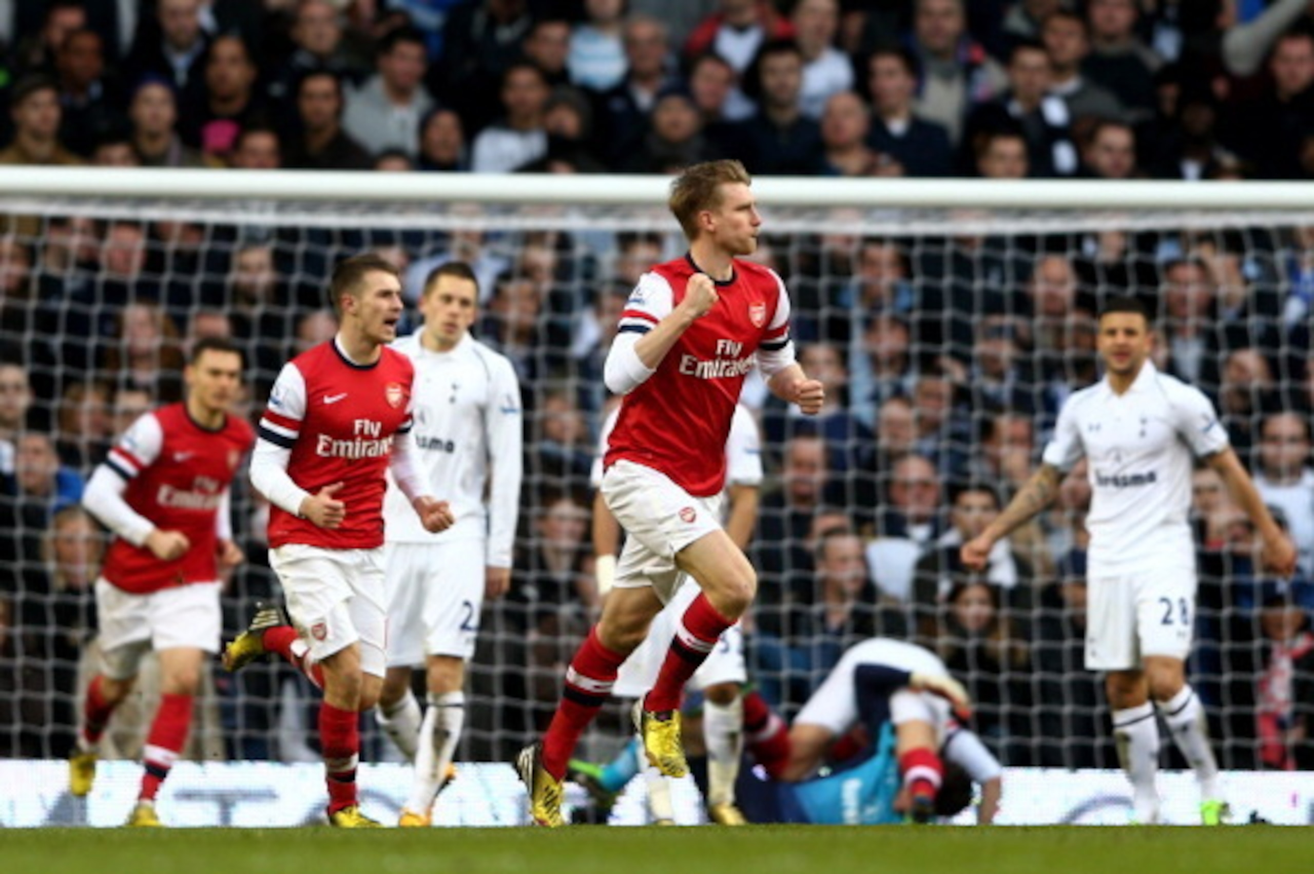 LONDON, ENGLAND - MARCH 03:  Per Mertesacker of Arsenal celebrates after scoring his team's first goal during the Barclays Premier League match between Tottenham Hotspur and Arsenal FC at White Hart Lane on March 3, 2013 in London, England.  (Photo by Pau
