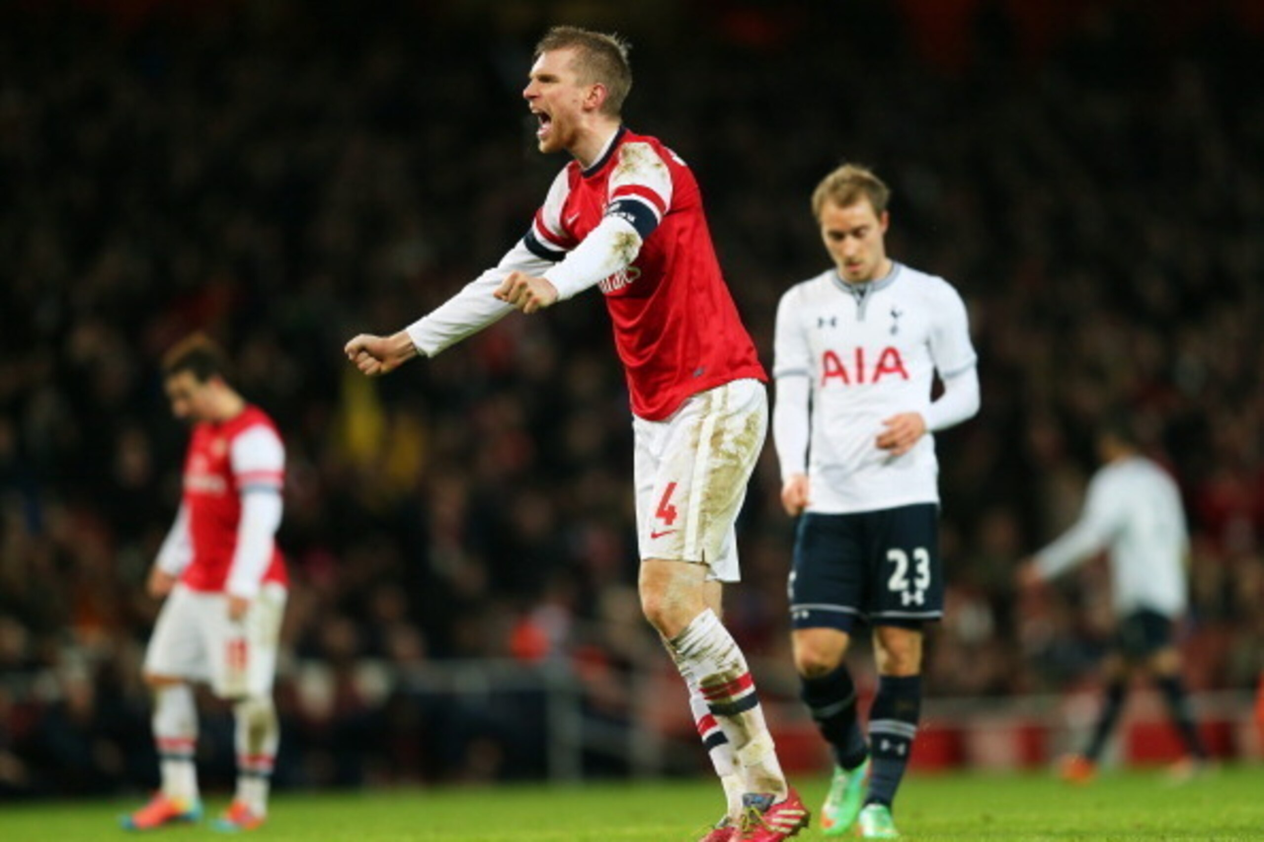 LONDON, ENGLAND - JANUARY 04:  Per Mertesacker of Arsenal celebrates his team's 2-0 victory during the Budweiser FA Cup third round match between Arsenal and Tottenham Hotspur at Emirates Stadium on January 4, 2014 in London, England.  (Photo by Clive Ros