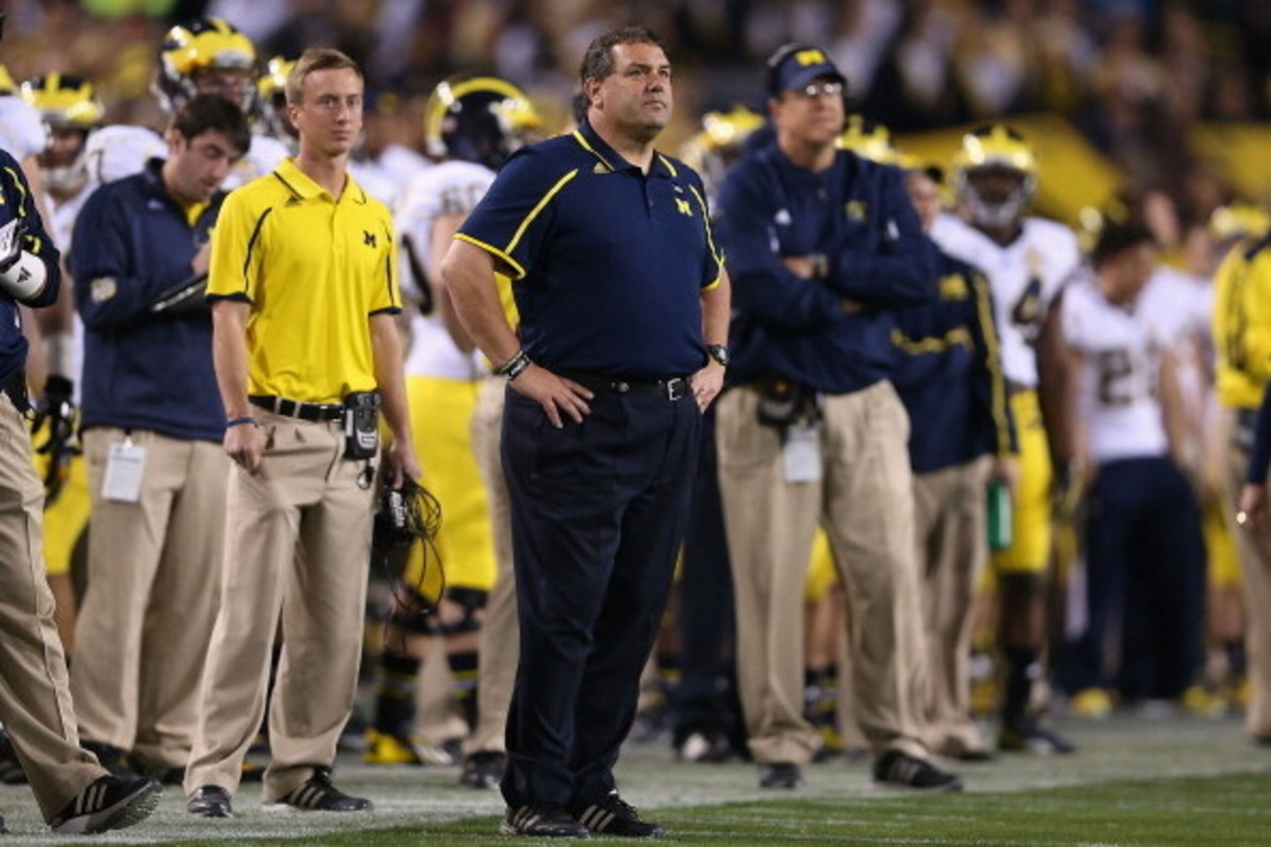 TEMPE, AZ - DECEMBER 28:  Head coach Brady Hoke of the Michigan Wolverines watches from the sidelines during the first quarter of the Buffalo Wild Wings Bowl against the Kansas State Wildcats at Sun Devil Stadium on December 28, 2013 in Tempe, Arizona.  (