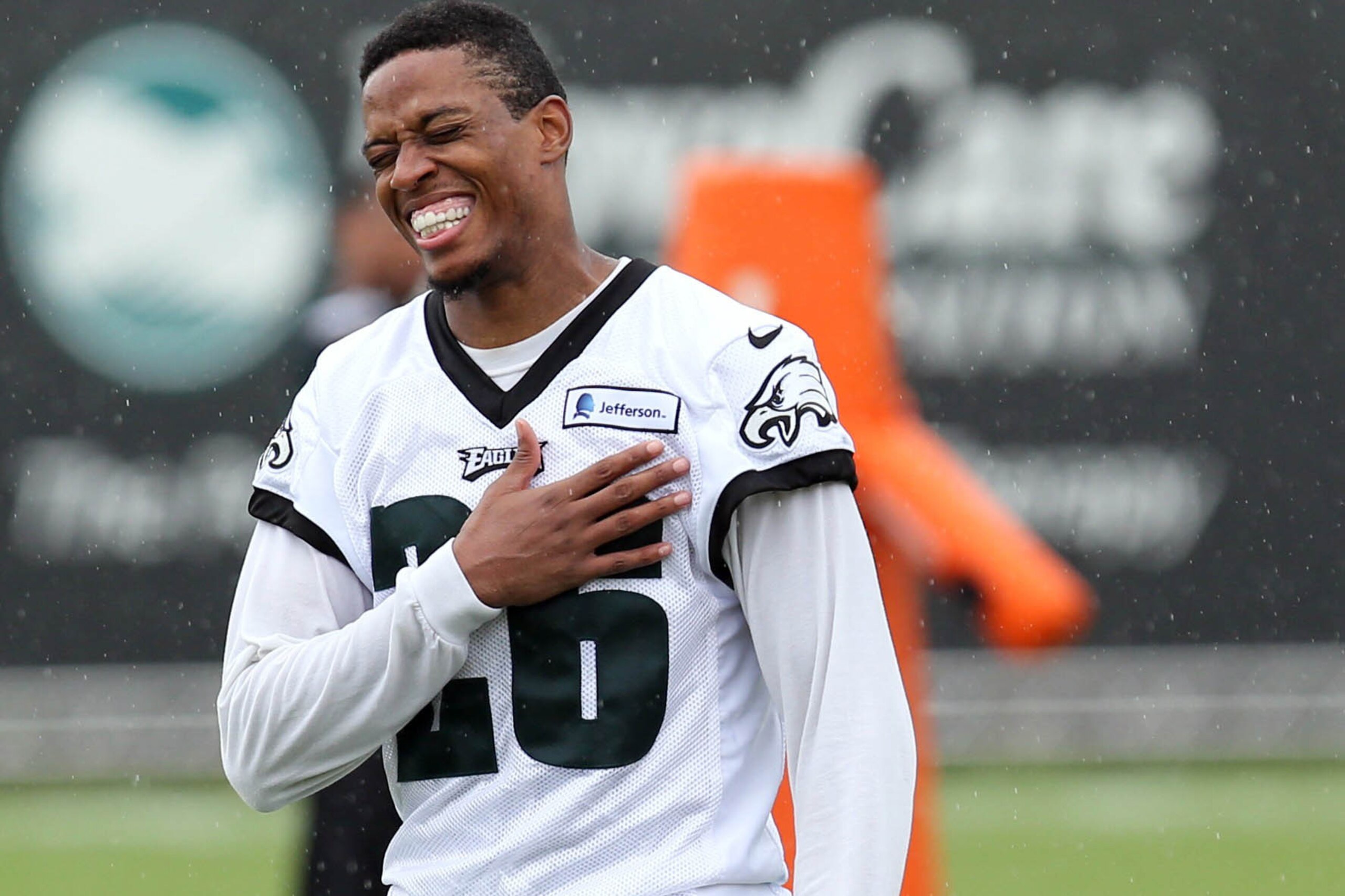 Jul 26, 2014; Philadelphia, PA, USA; Philadelphia Eagles cornerback Cary Williams (26) laughs as he walks off the field after training camp practice at the Novacare Complex in Philadelphia PA. Mandatory Credit: Bill Streicher-USA TODAY Sports
