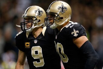 NEW ORLEANS, LA - DECEMBER 08:  Drew Brees #9 and  Jimmy Graham #80 of the New Orleans Saints celebrate after a touchdown against the Carolina Panthersat Mercedes-Benz Superdome on December 8, 2013 in New Orleans, Louisiana.  (Photo by Chris Graythen/Gett