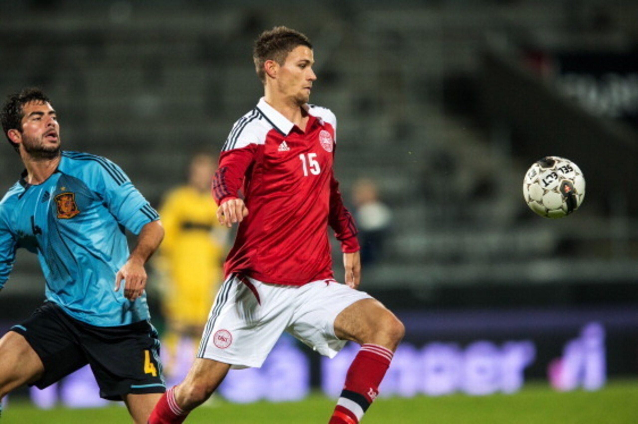 AALBORG, DENMARK - OCTOBER 16:  Nicklas Helenius of Denmark shields the ball from Jordi Amat of Spain during the UEFA European Under-21 Championship play-off second leg match between Denmark and Spain held on October 16, 2012 at the Aalborg Stadion in Aal