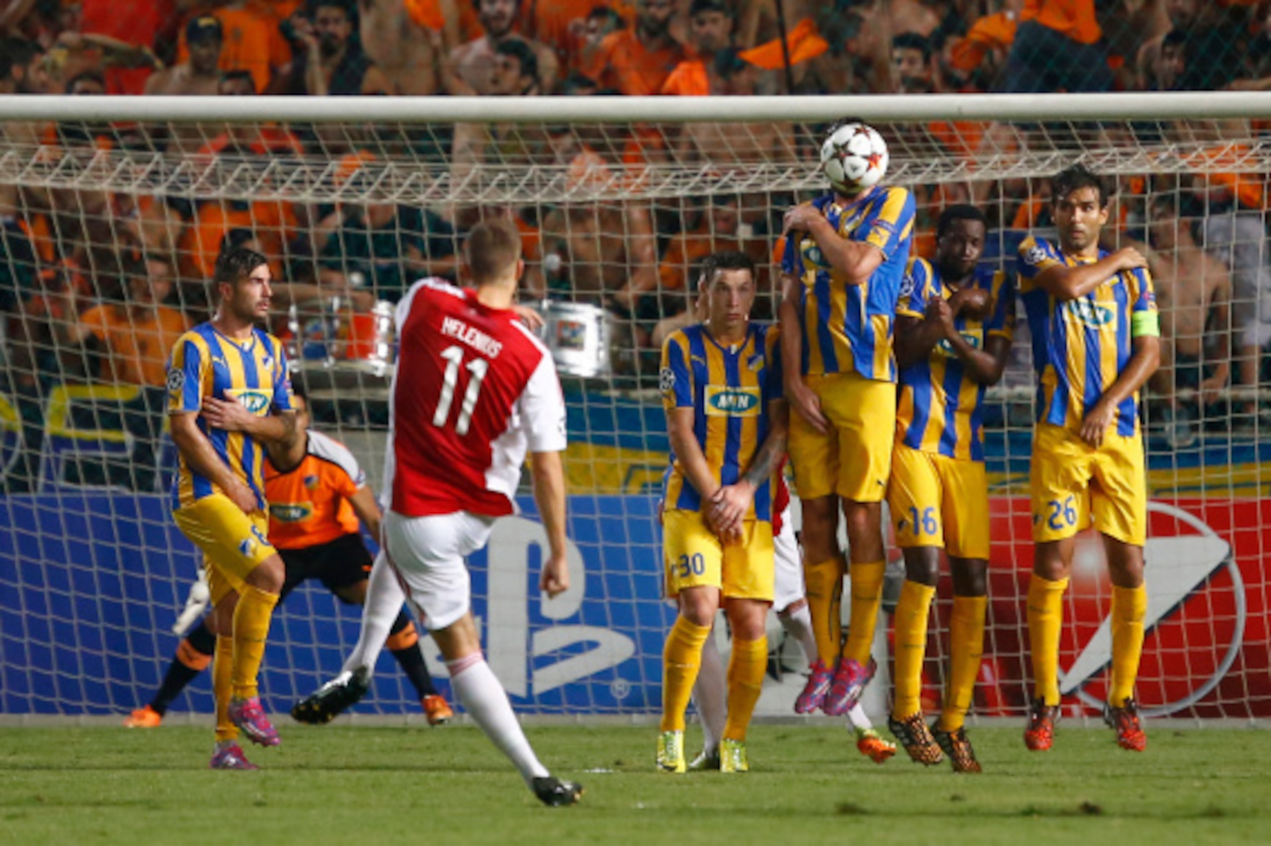 NICOSIA, CYPRUS - AUGUST 26:   Nicklas Helenius (C)  from Aalborg BK attempts a free kick during the  match between  Aalborg BK and Apoel Nicosia in the Second Round of the UEFA Champions League Qualifying Play-Offs on August 26, 2014 in Nicosia, Cyprus. 