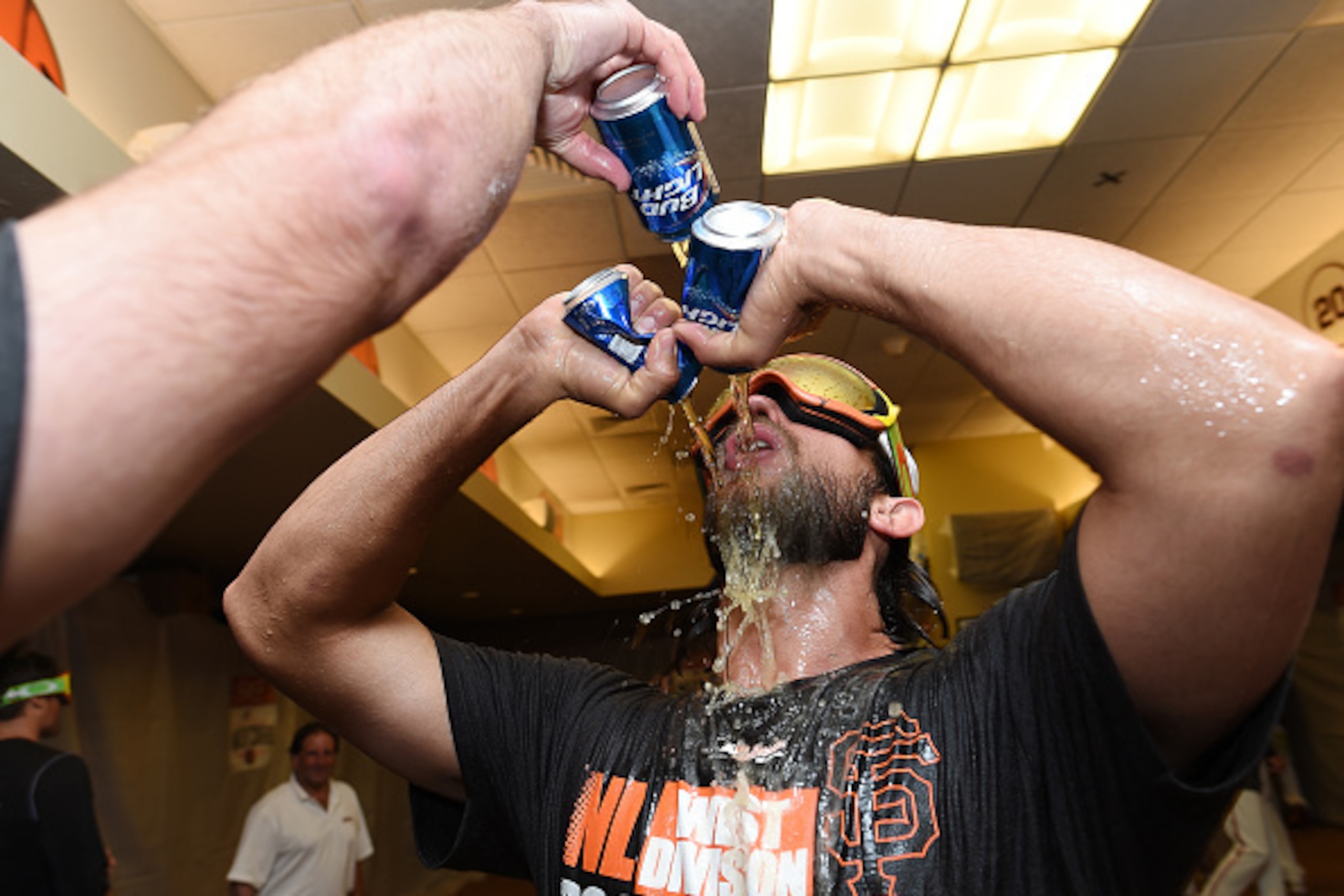 SAN FRANCISCO, CA - SEPTEMBER 25:  Madison Bumgarner #40 of the San Francisco Giants celebrates the wild card playoff birth after they defeated the San Diego Padres 9-8 at AT&T Park on September 25, 2014 in San Francisco, California.  (Photo by Thearon W.
