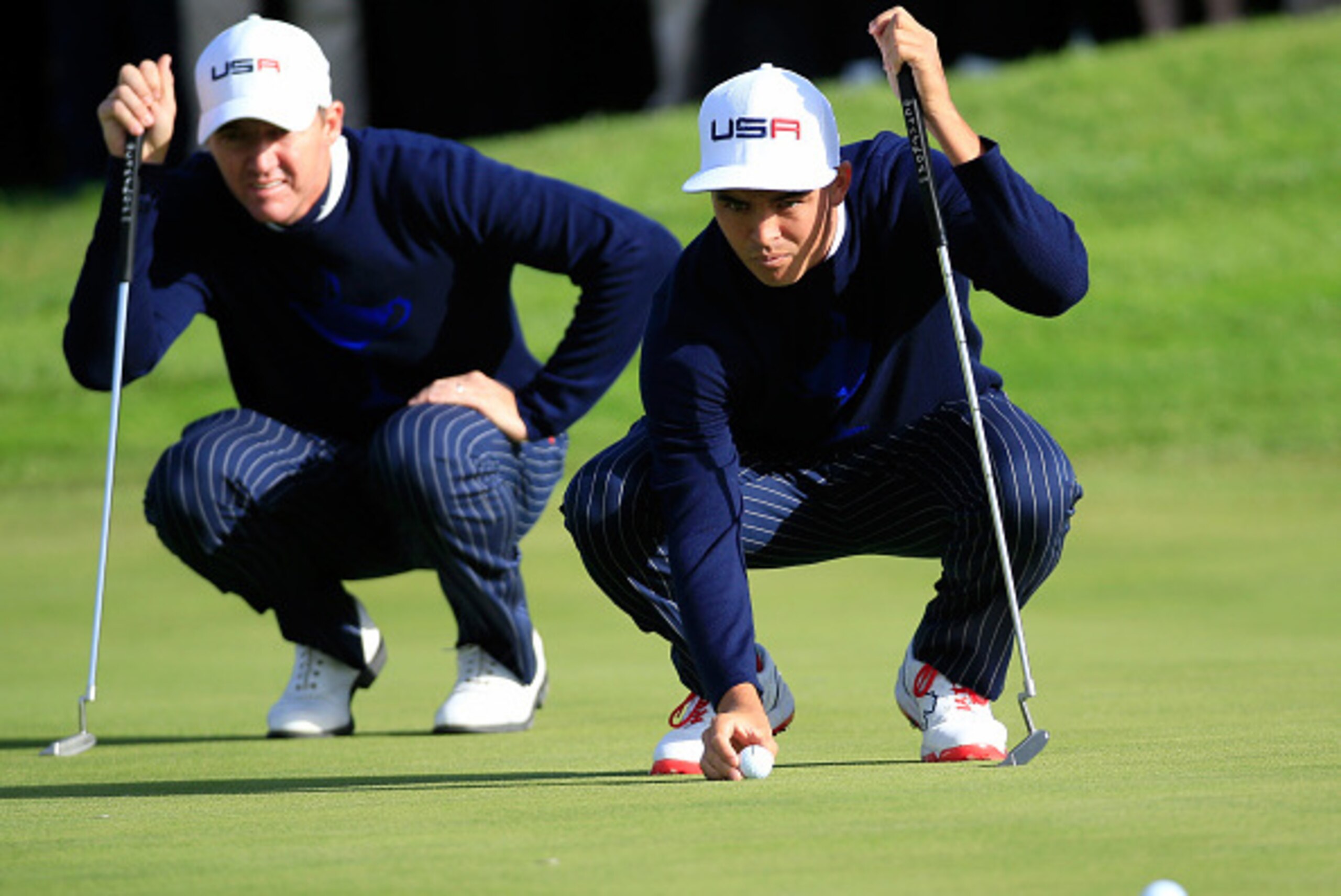 AUCHTERARDER, SCOTLAND - SEPTEMBER 26:  Jimmy Walker of the United States (L) and Rickie Fowler of the United States line up a putt on the 10th green during the Morning Fourballs of the 2014 Ryder Cup on the PGA Centenary course at the Gleneagles Hotel on