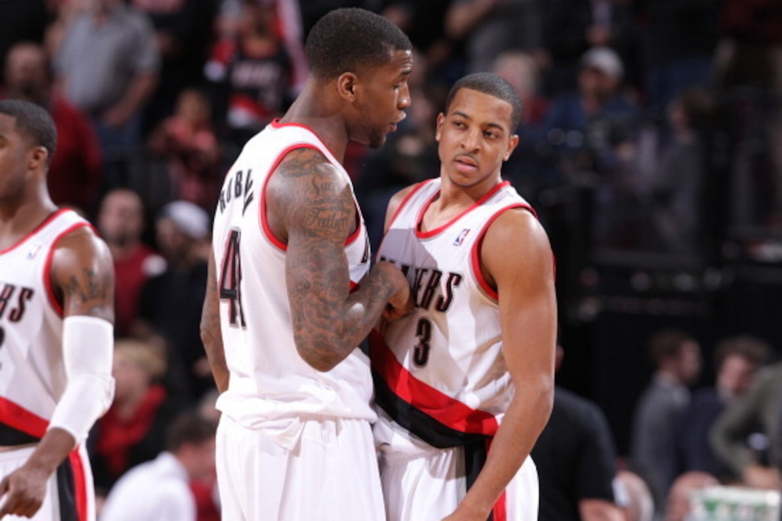 PORTLAND, OR - JANUARY 23:  Thomas Robinson #41 and C.J. McCollum #3 of the Portland Trail Blazers talk during the game against the Denver Nuggets on January 23, 2014 at the Moda Center Arena in Portland, Oregon. NOTE TO USER: User expressly acknowledges 
