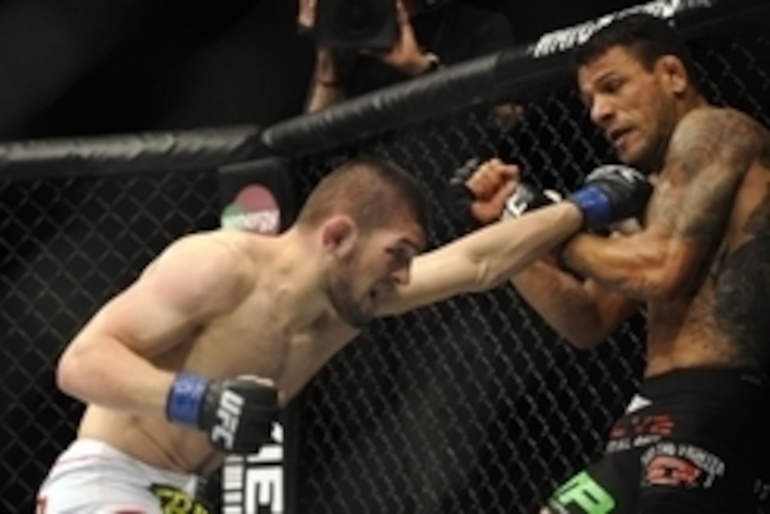 Apr 19, 2014; Orlando, FL, USA; Rafael dos Anjos (red gloves) fights Khabib Nurmagomedov (blue gloves) in their lightweight fight during UFC on FOX 11 at Amway Center. Mandatory Credit: David Manning-USA TODAY Sports