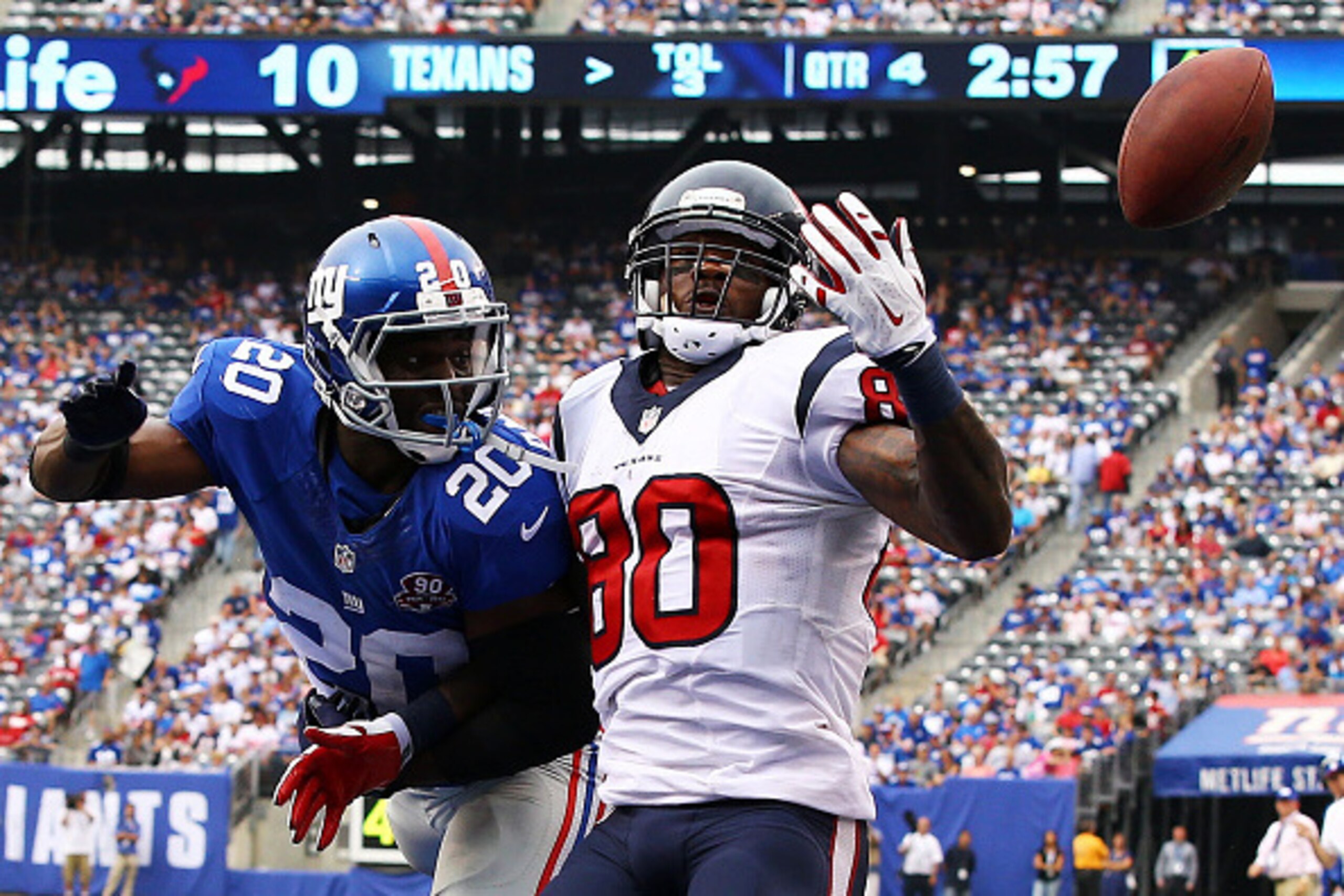 EAST RUTHERFORD, NJ - SEPTEMBER 21:  Prince Amukamara #20 of the New York Giants breaks up a pass against Andre Johnson #80 of the Houston Texans at MetLife Stadium on September 21, 2014 in East Rutherford, New Jersey.  (Photo by Al Bello/Getty Images)
